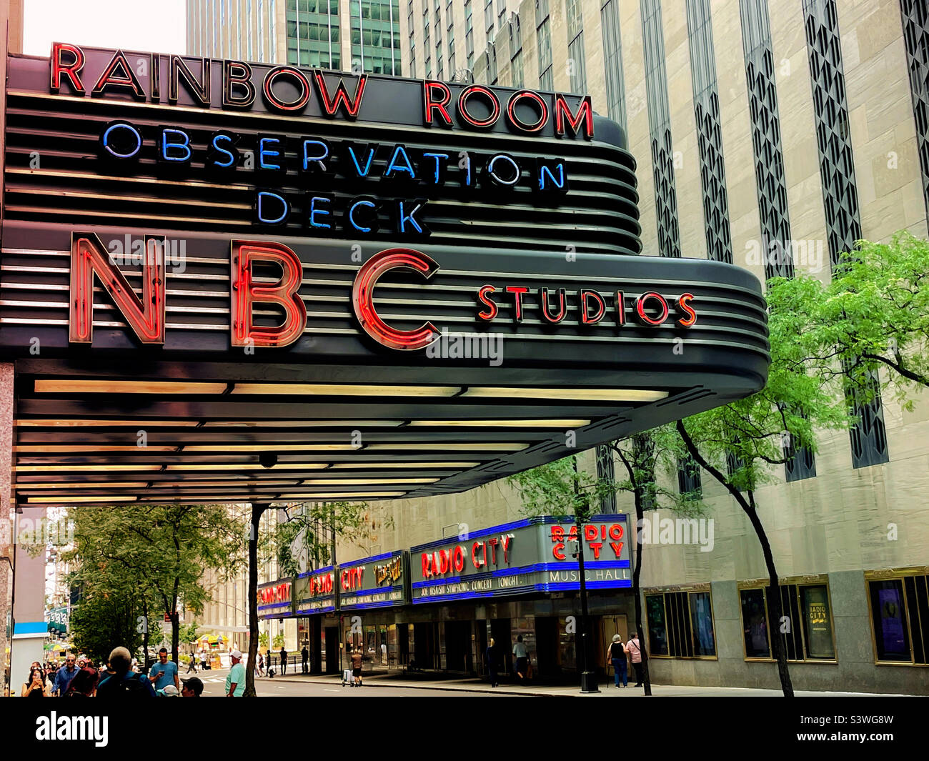 The marquee for NBC television studios and the rainbow room across the street from radio city music Hall in Rockefeller Center,, 2022, New York City, USA - Smartphone Captured Stock Image