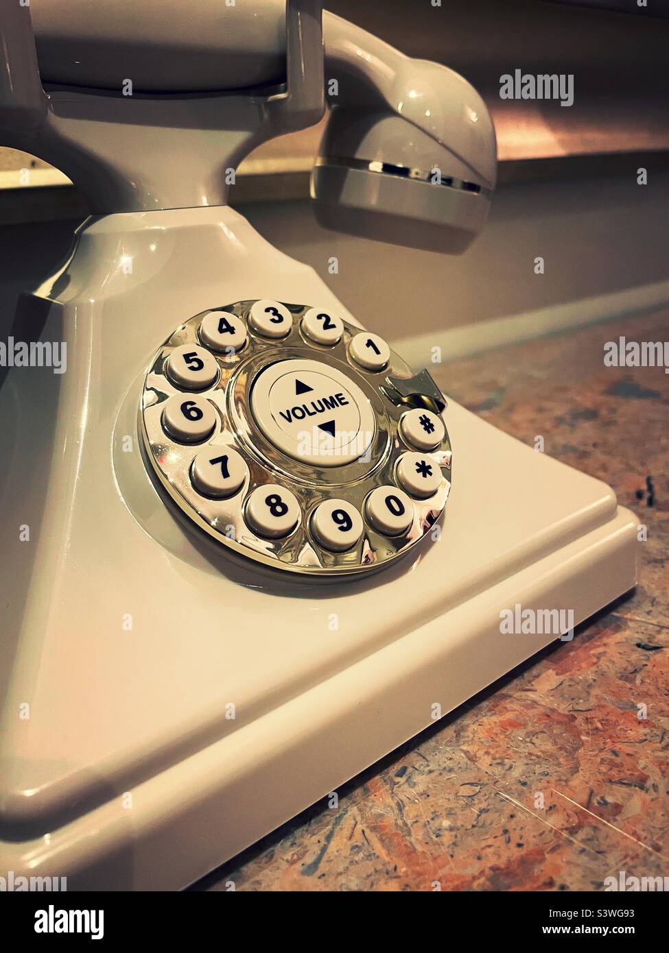 Close up of a push button stylized house phone in an upscale hotel lobby, New York City, USA, 2022 - Smartphone Captured Stock Image