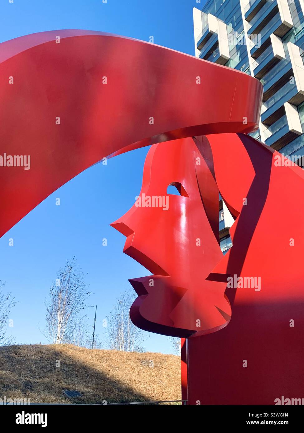 Approaching red sculpture by maha mustafa in North Greenwich Stock Photo