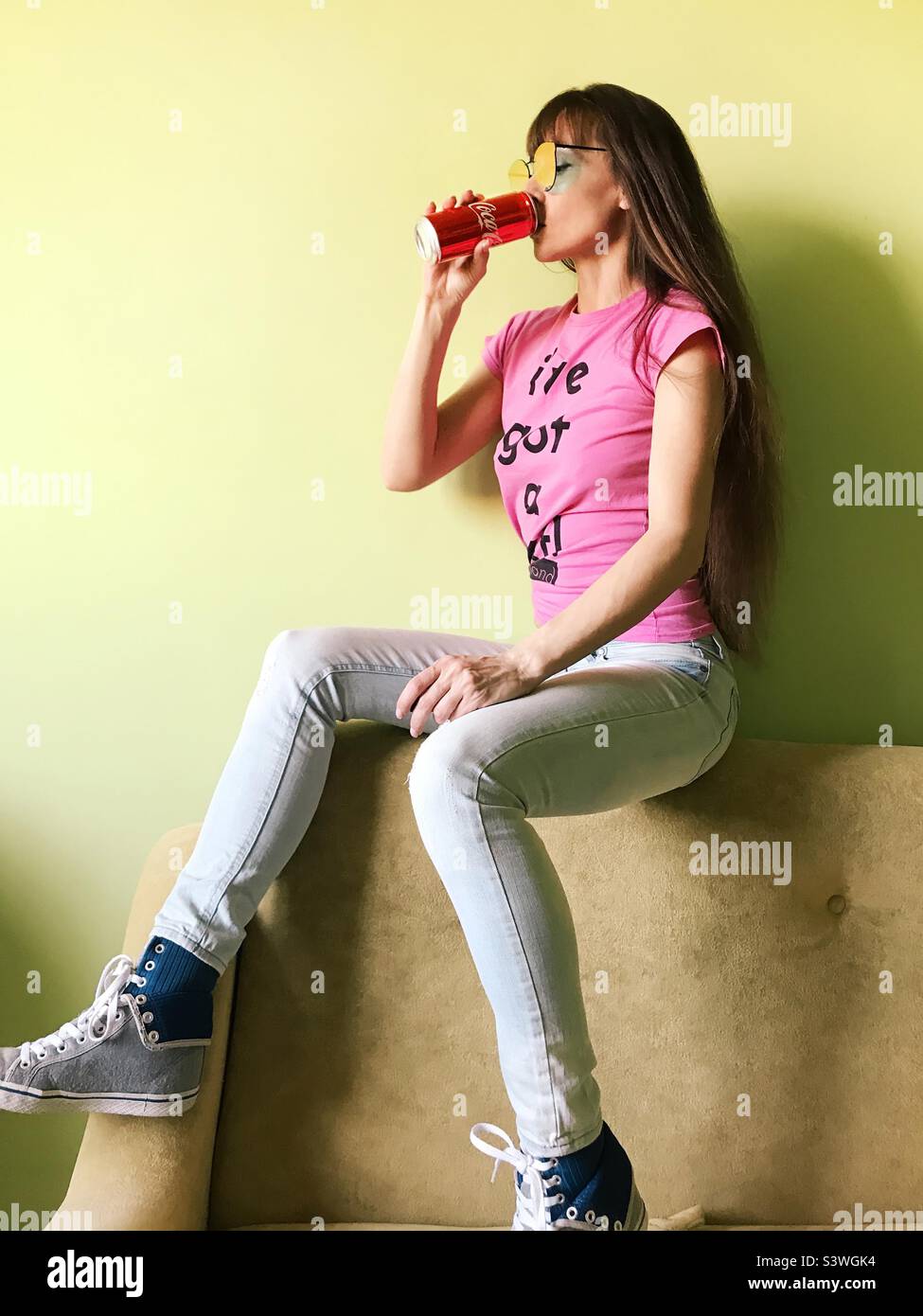 Young woman drinking cocacola Stock Photo Alamy