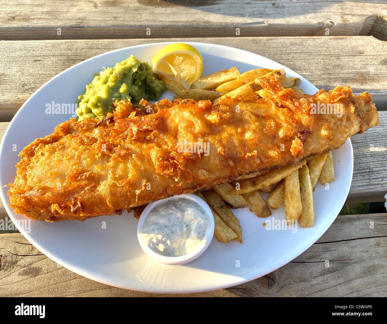 Beer battered fish with triple cooked chips - Smartphone Captured Stock Image