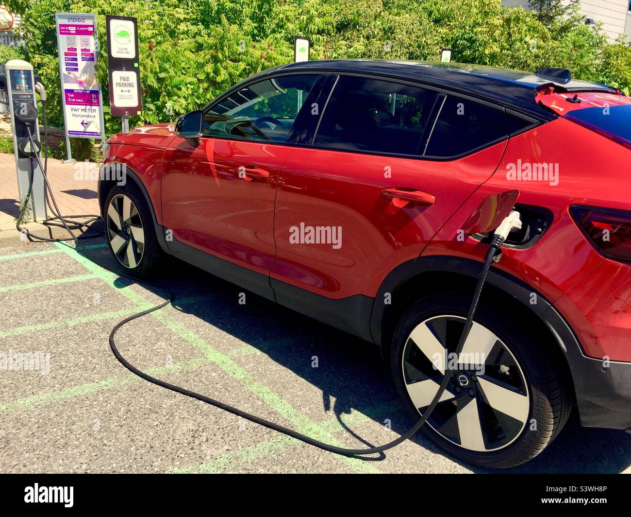 Electric car recharging, Canada Stock Photo
