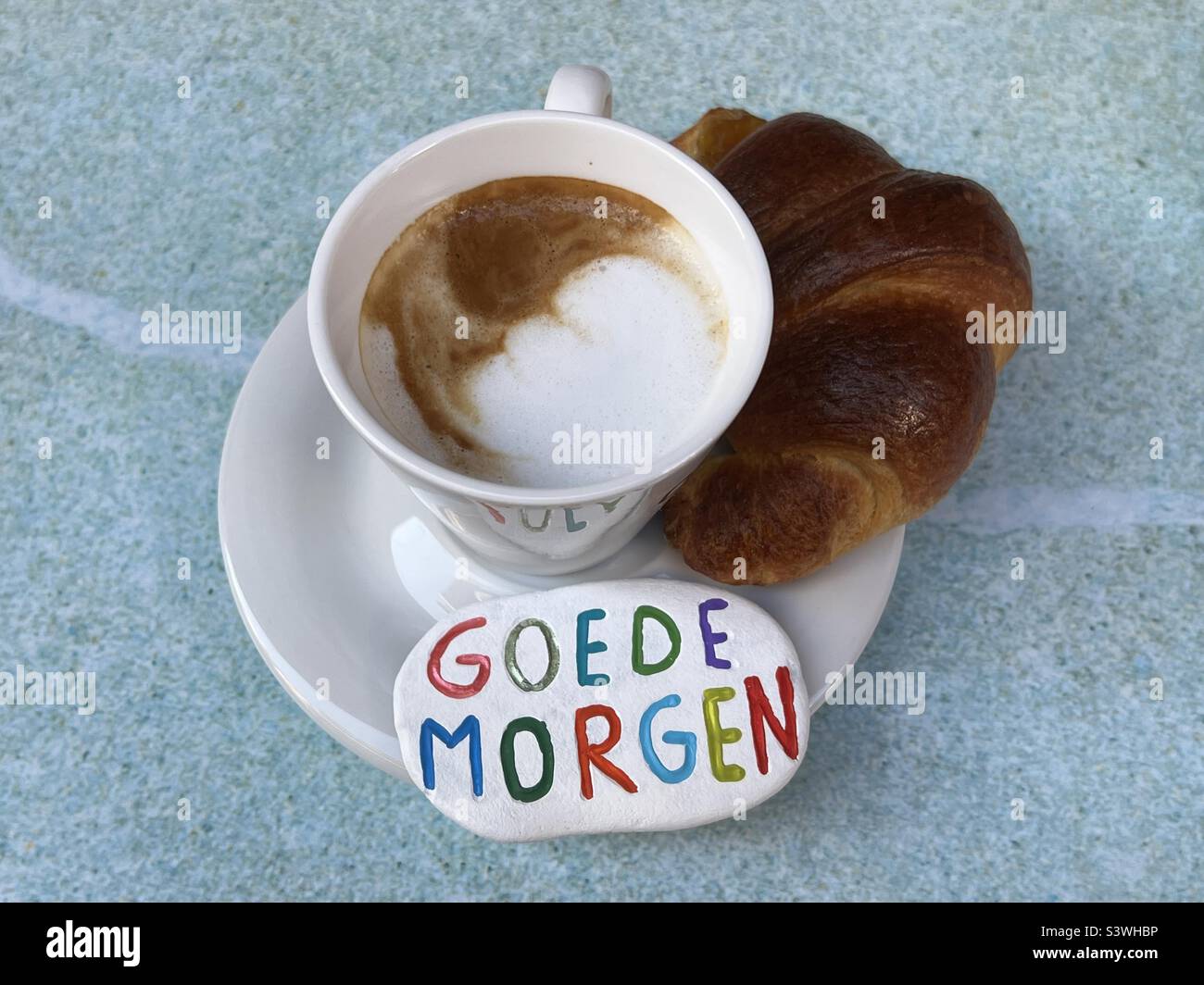 Goedemorgen Netherlands with cappuccino and croissant Stock Photo