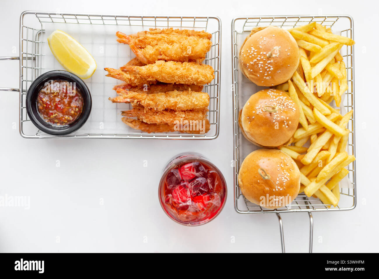 Breaded shrimps and mini burgers, starters for lunch with a cocktail, top view - Smartphone Captured Stock Image