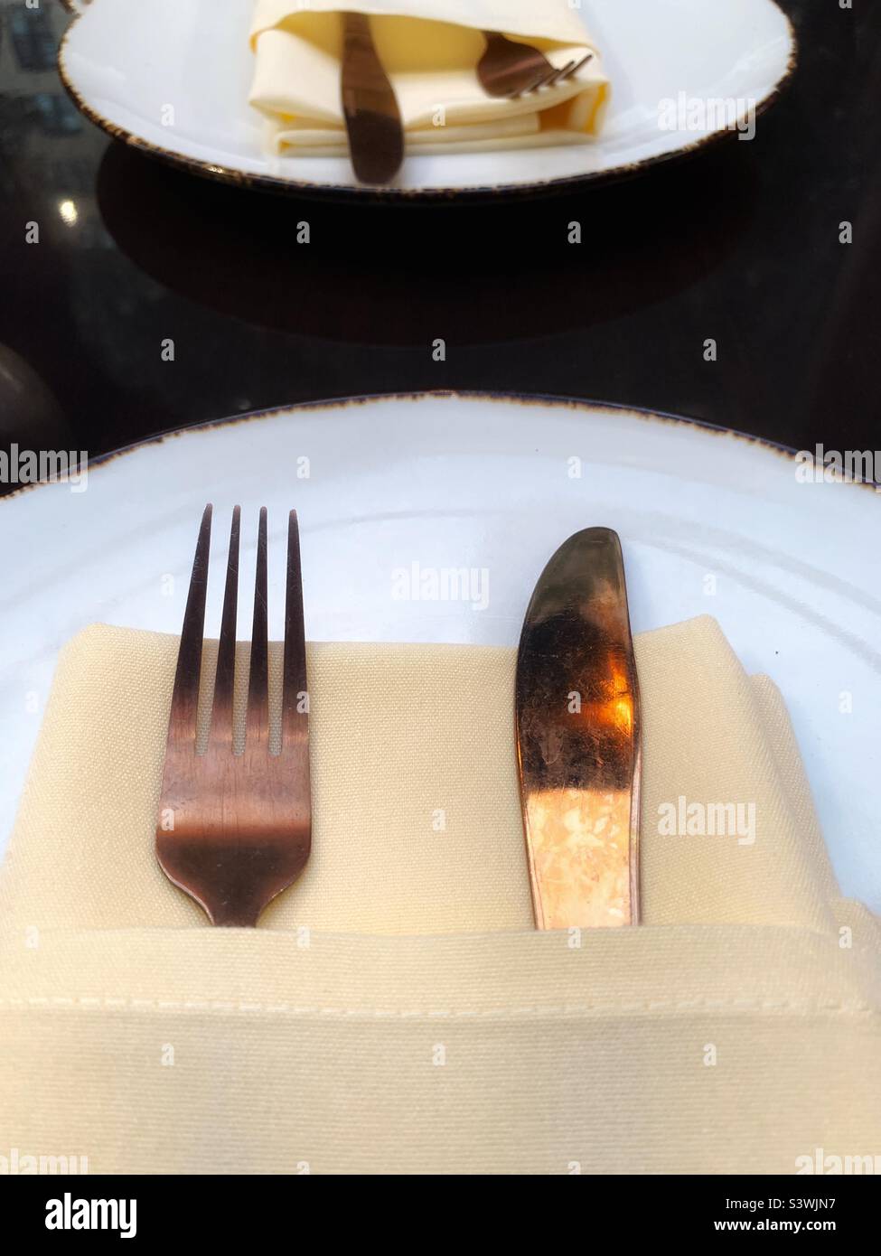 Forks and knives on the plate - Smartphone Captured Stock Image