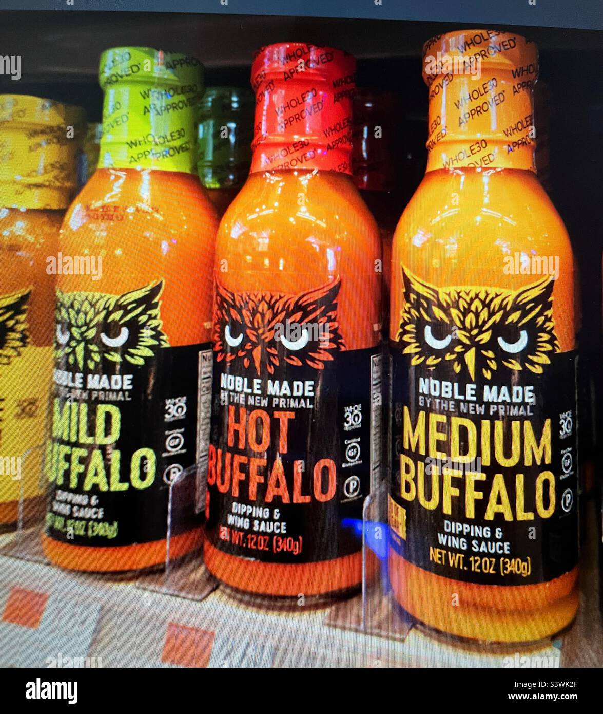 Close up of bottles of hot sauce in a grocery store, 2022, USA - Smartphone Captured Stock Image