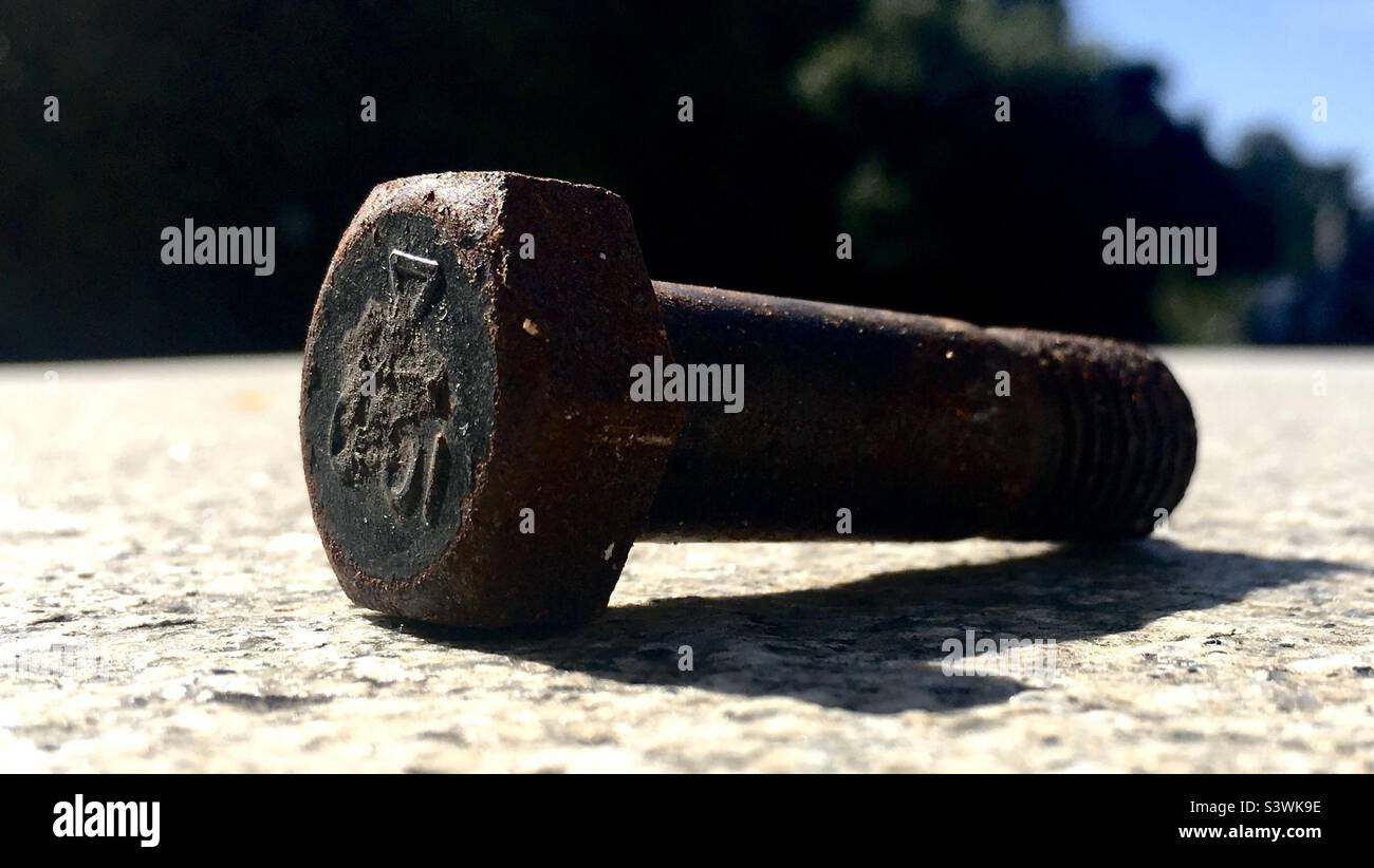 Rusted steel bolt on a stone barricade Stock Photo Alamy