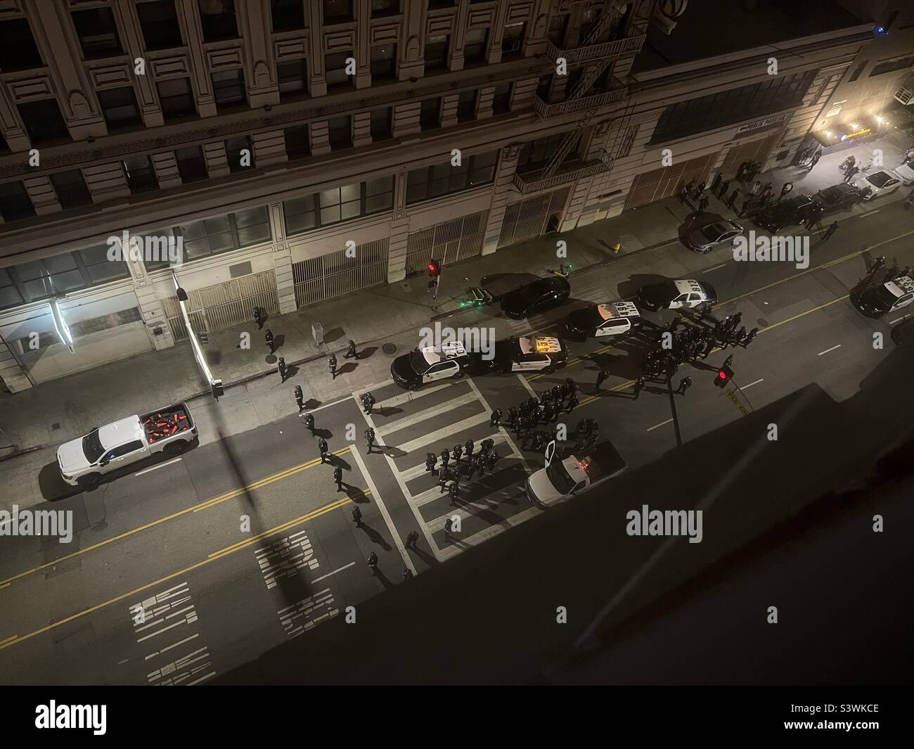 LOS ANGELES, CA, MAY 2022: high viewpoint, looking down on street where Los Angeles Police Dept officers are preparing for protestors to come through Downtown - Smartphone Captured Stock Image