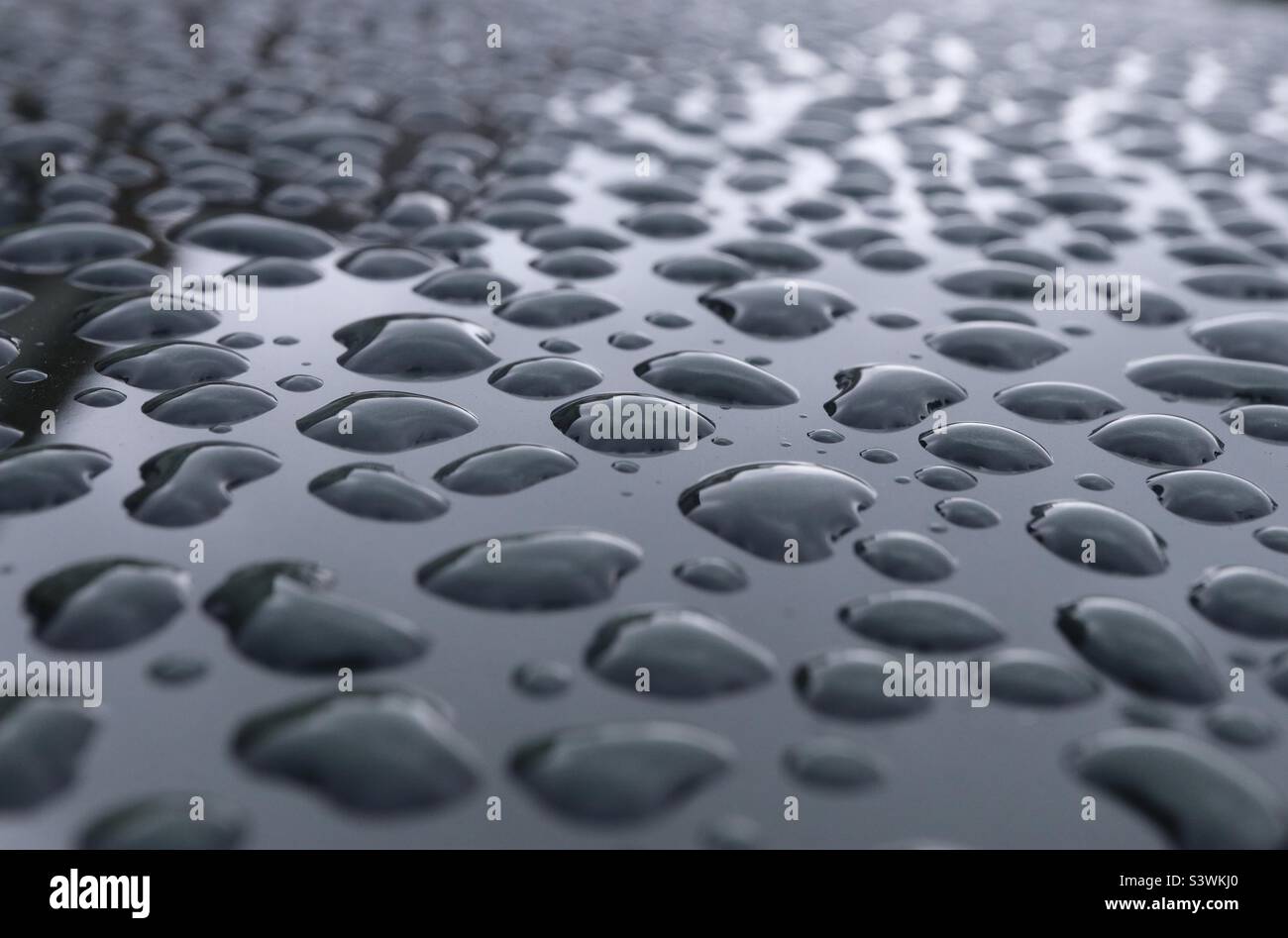 Rain drops on a new car - Smartphone Captured Stock Image