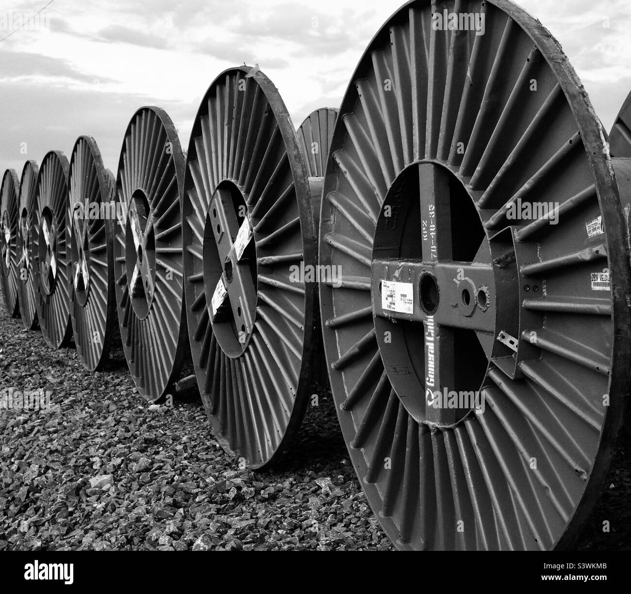 Heavy duty cable reels in black and white. - Smartphone Captured Stock Image
