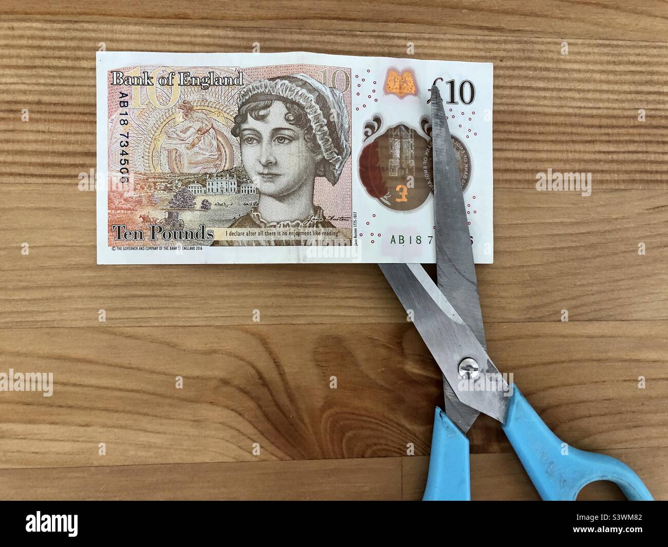 Conceptual image on budget cut - Smartphone Captured Stock Image