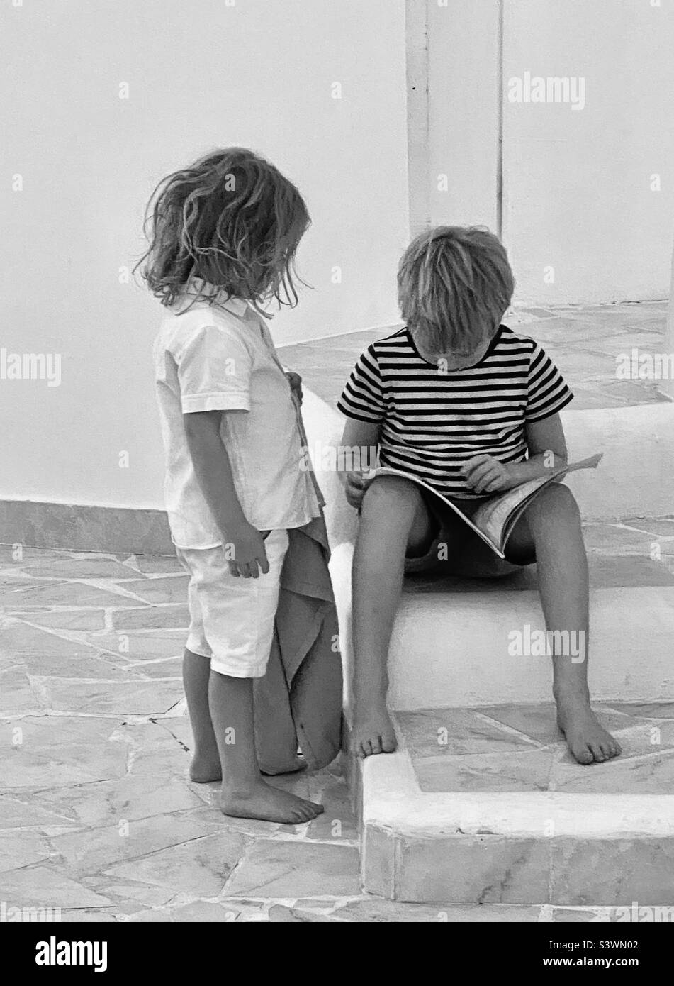 Two children reading - Smartphone Captured Stock Image