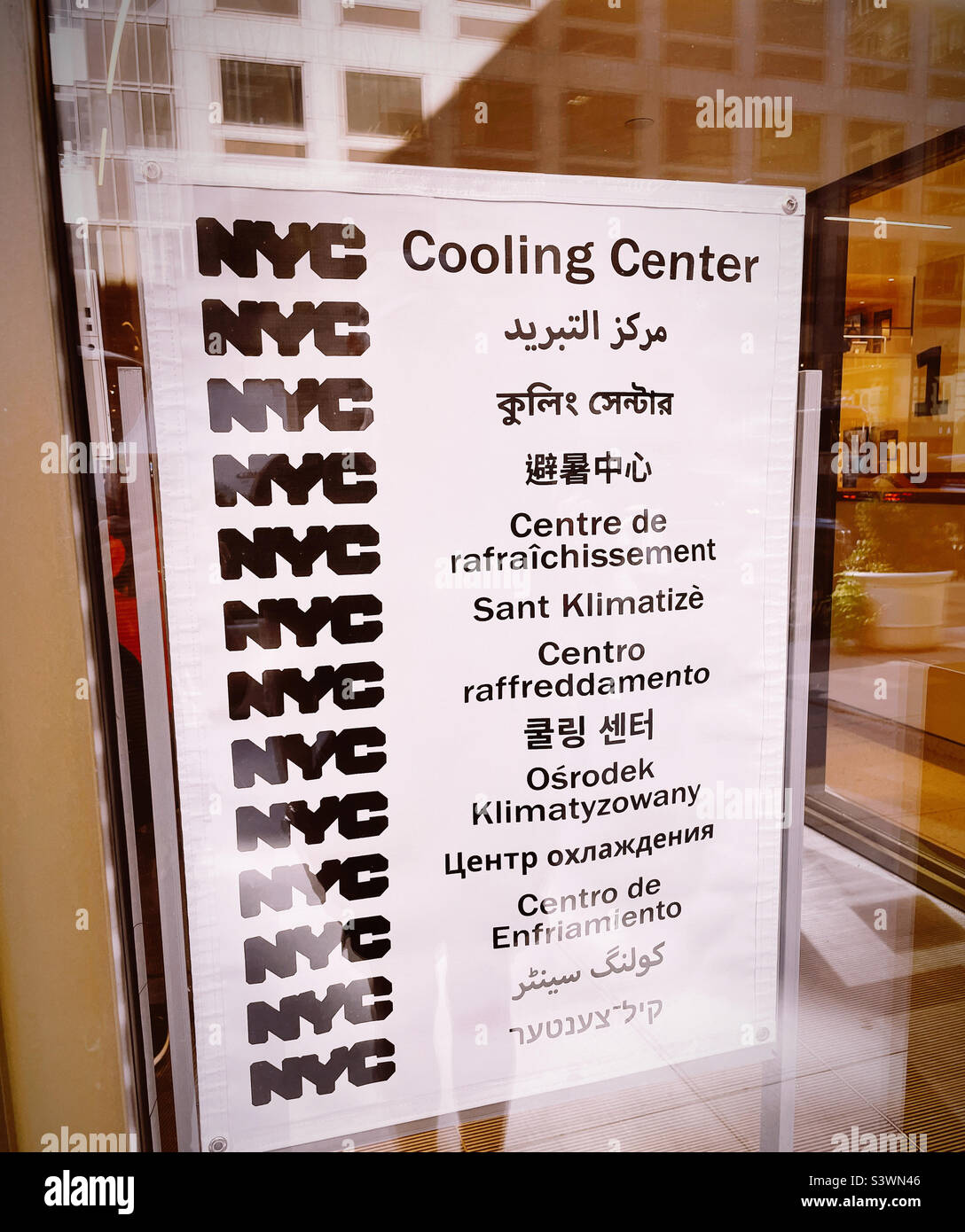 Multilingual cooling center sign in Midtown Manhattan, summertime 2022, NYC, USA Stock Photo