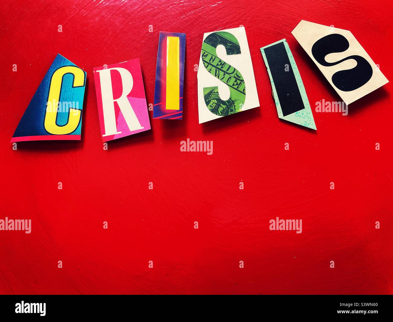 Crisis spelled out in ransom note typography onA red background, 2022, USA Stock Photo