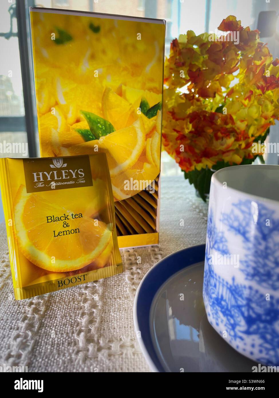 Close up of Haley’s tea packaging and a tea cup Stock Photo