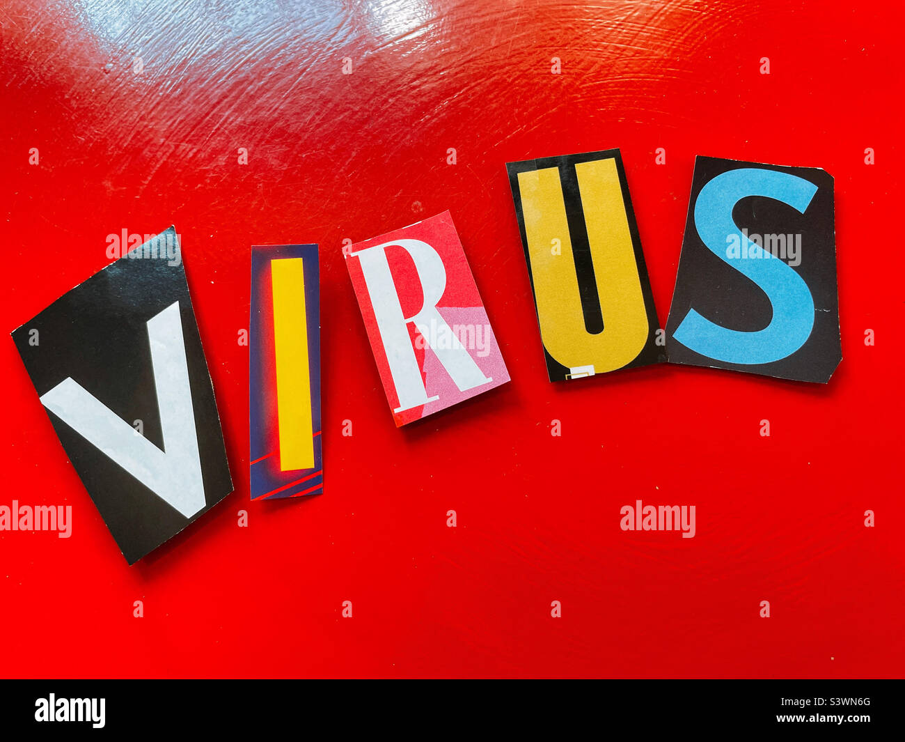 Virus spelled out in Ransom noteStyle topography on A red background, 2022, USA Stock Photo
