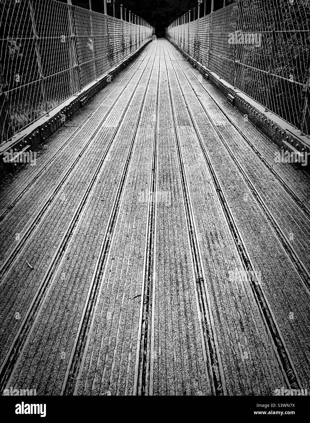 ‘One way across…’ sometimes you have to cross the bridge to reach your destination Stock Photo