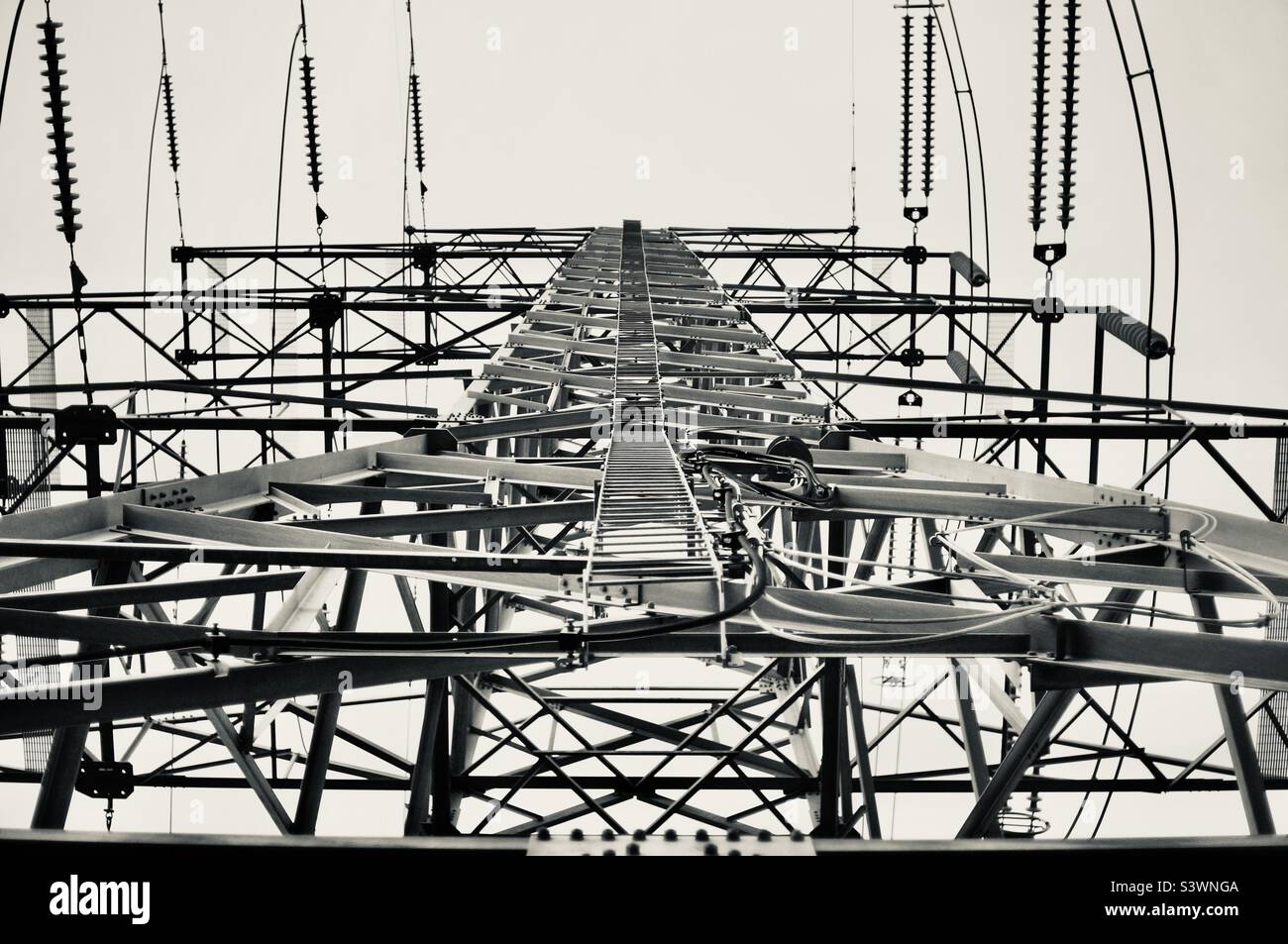 Looking up at a massive heavy duty hydro power line tower. - Smartphone Captured Stock Image