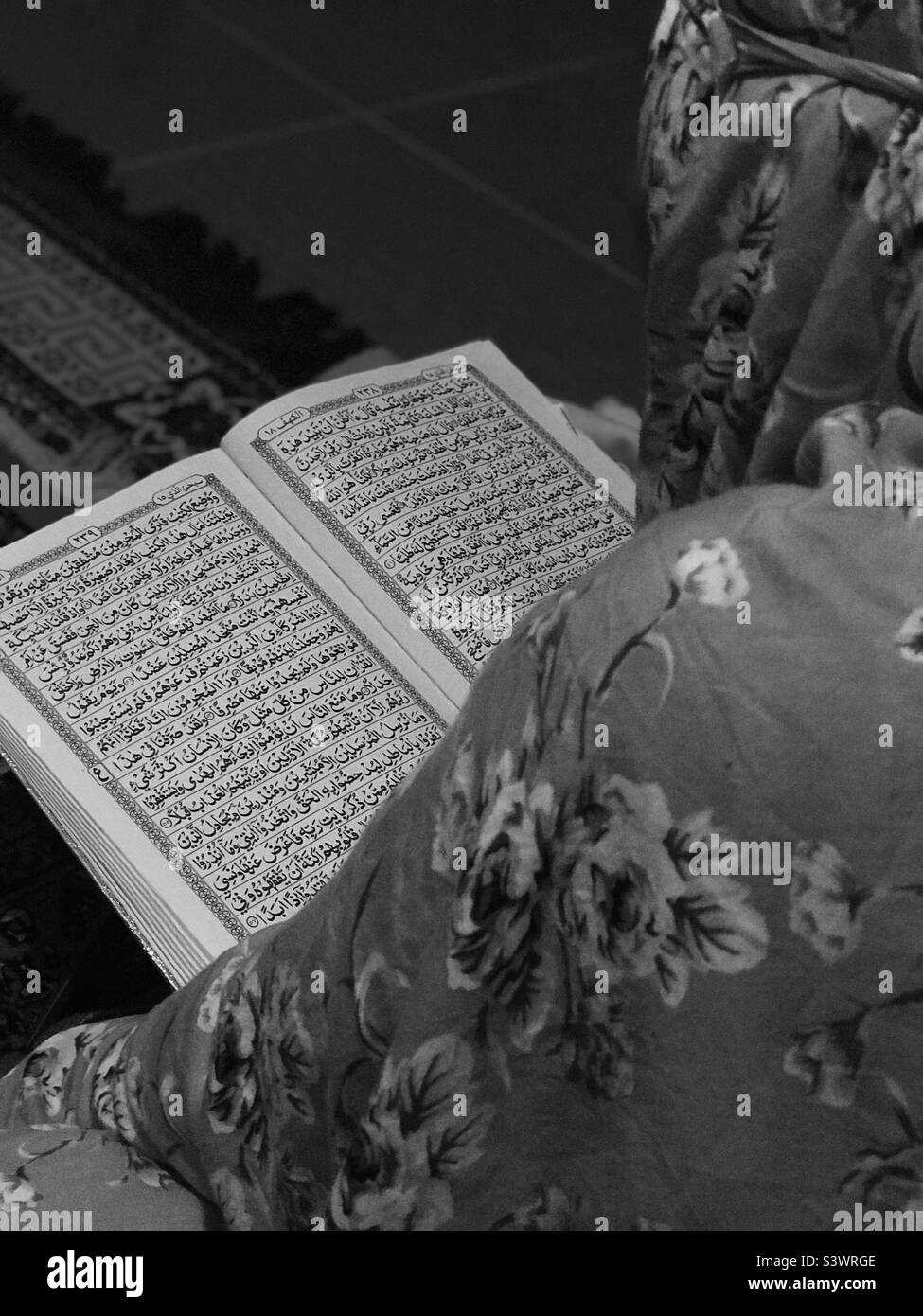 Reciting Holy Quran, after pray Isya’ Stock Photo
