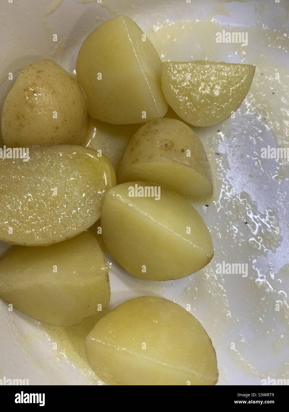 Boiled New Potatoes and Butter Stock Photo Alamy