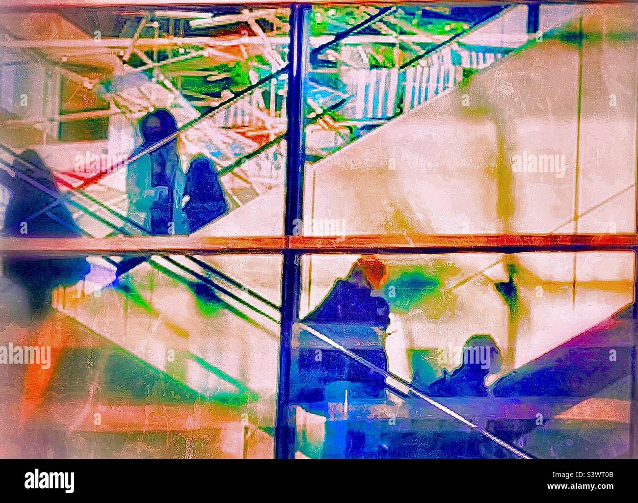 A painterly rendition of airline passengers on escalators in the Salt Lake City International Airport in Salt Lake City, Utah , USA during the Thanksgiving holidays. - Smartphone Captured Stock Image