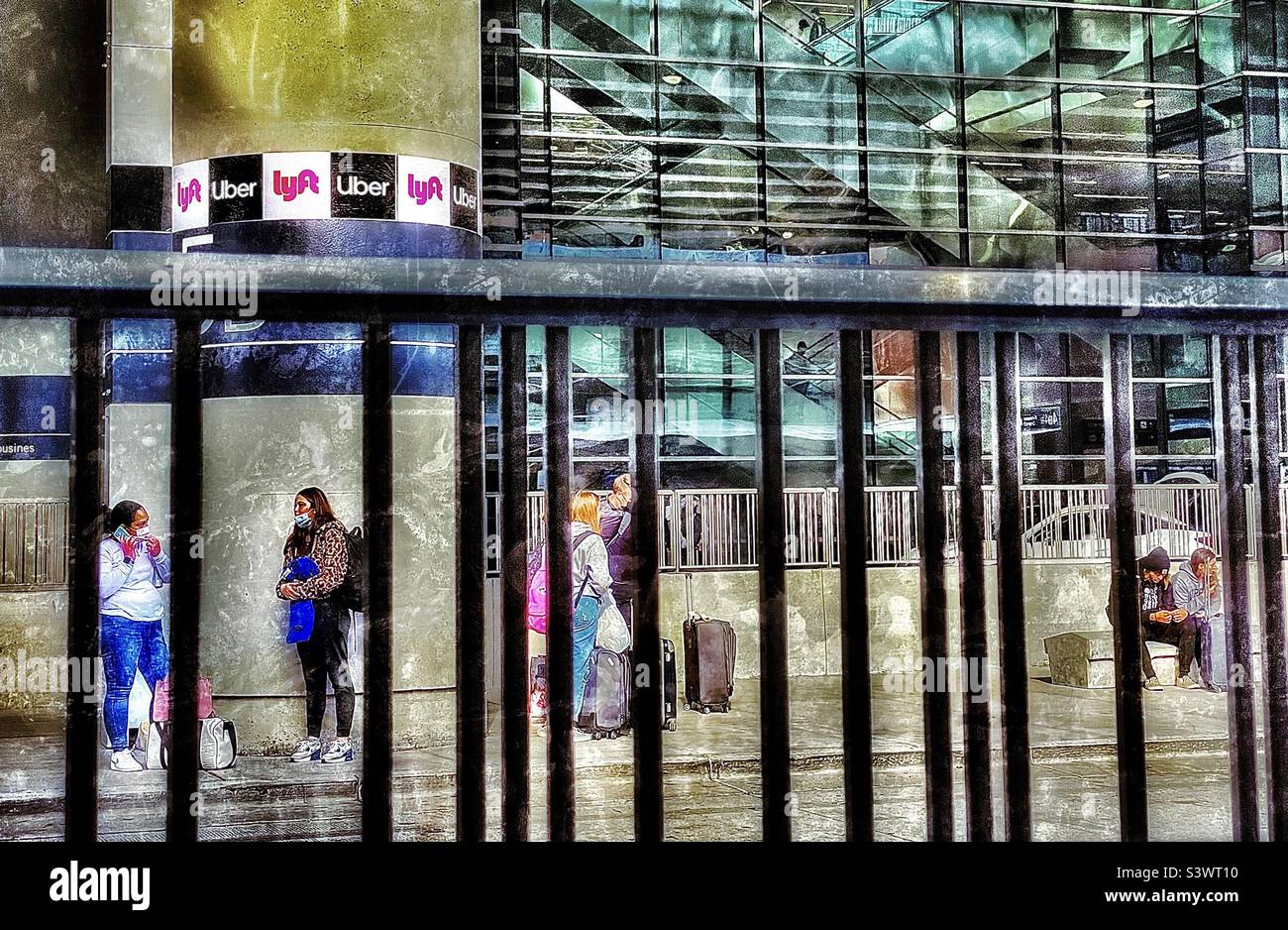 Airline passengers waiting at the taxi pickup area at the Salt Lake City International Airport in Salt Lake City, Utah , USA during the Thanksgiving holidays. - Smartphone Captured Stock Image