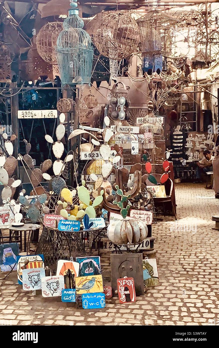 Metal goods on sale at a workshop in the Souks market, Marrakesh, Morocco, North Africa. - Smartphone Captured Stock Image