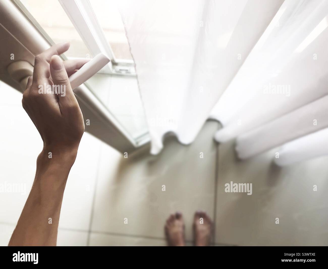 Opening the door to the terrace in the morning - Smartphone Captured Stock Image