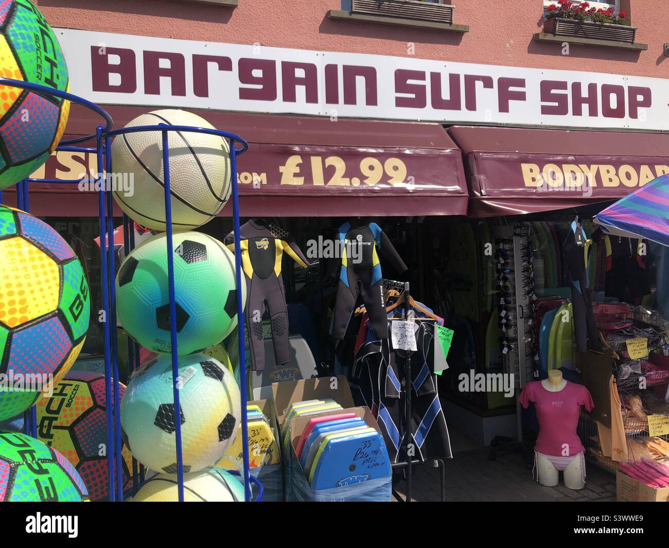 Bargain surf shop at a coastal town in Devon in the UK - Smartphone Captured Stock Image