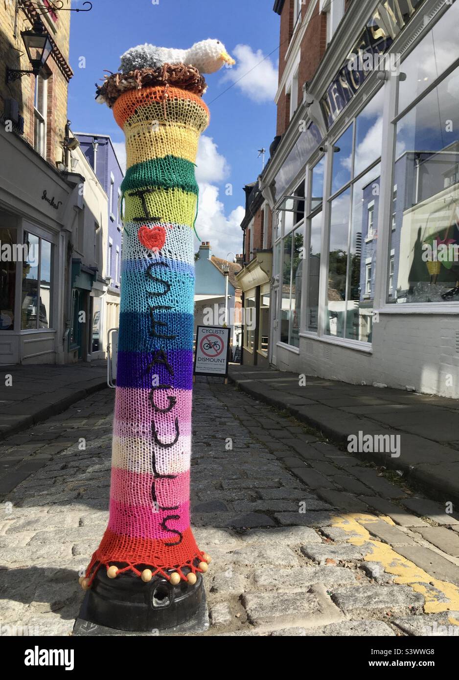 Knitted Rainbow Post Cover in High Street Stock Photo Alamy