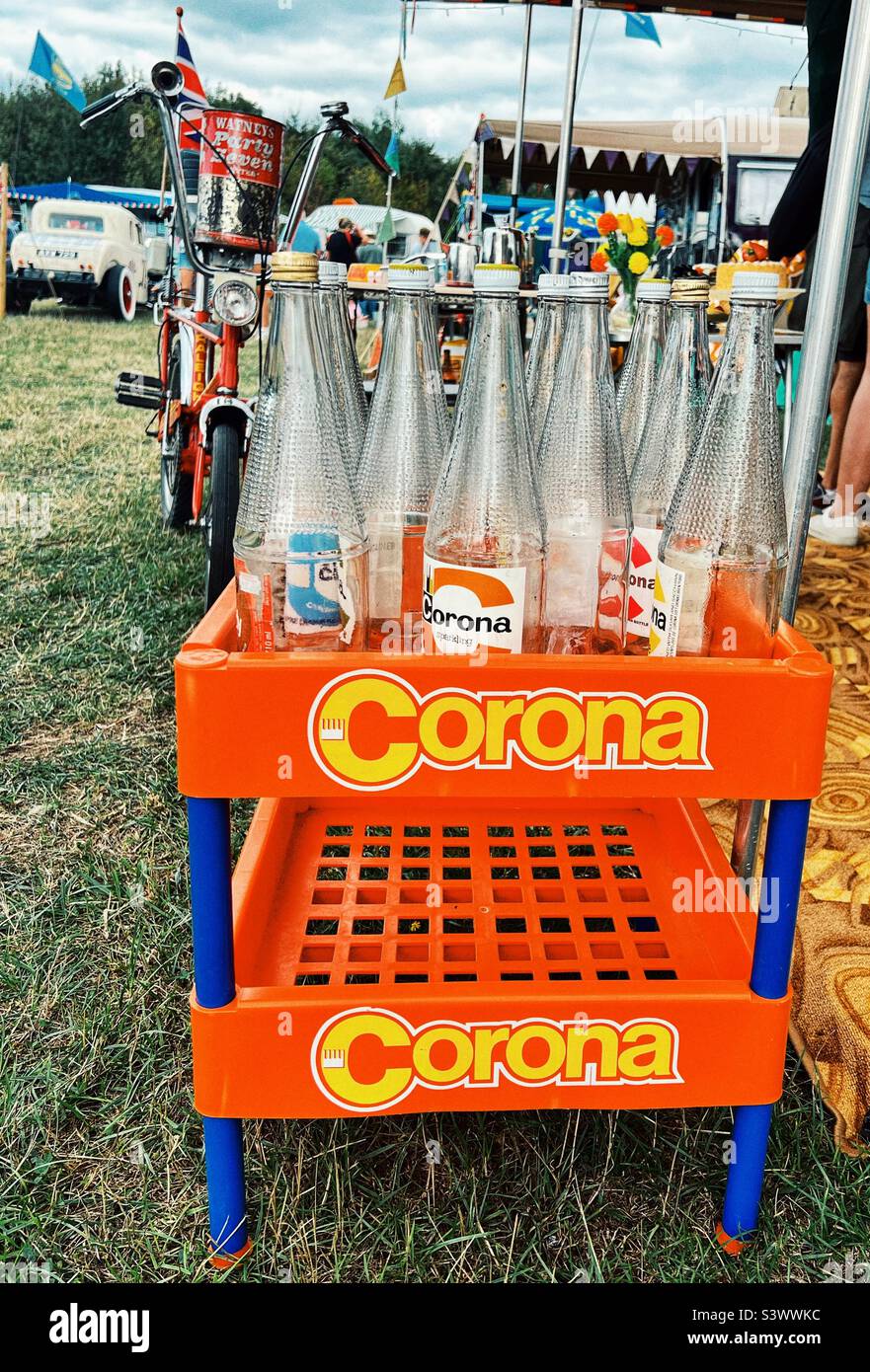 Old Corona Pop bottles from the 1970’s in a Corona display stand Stock Photo