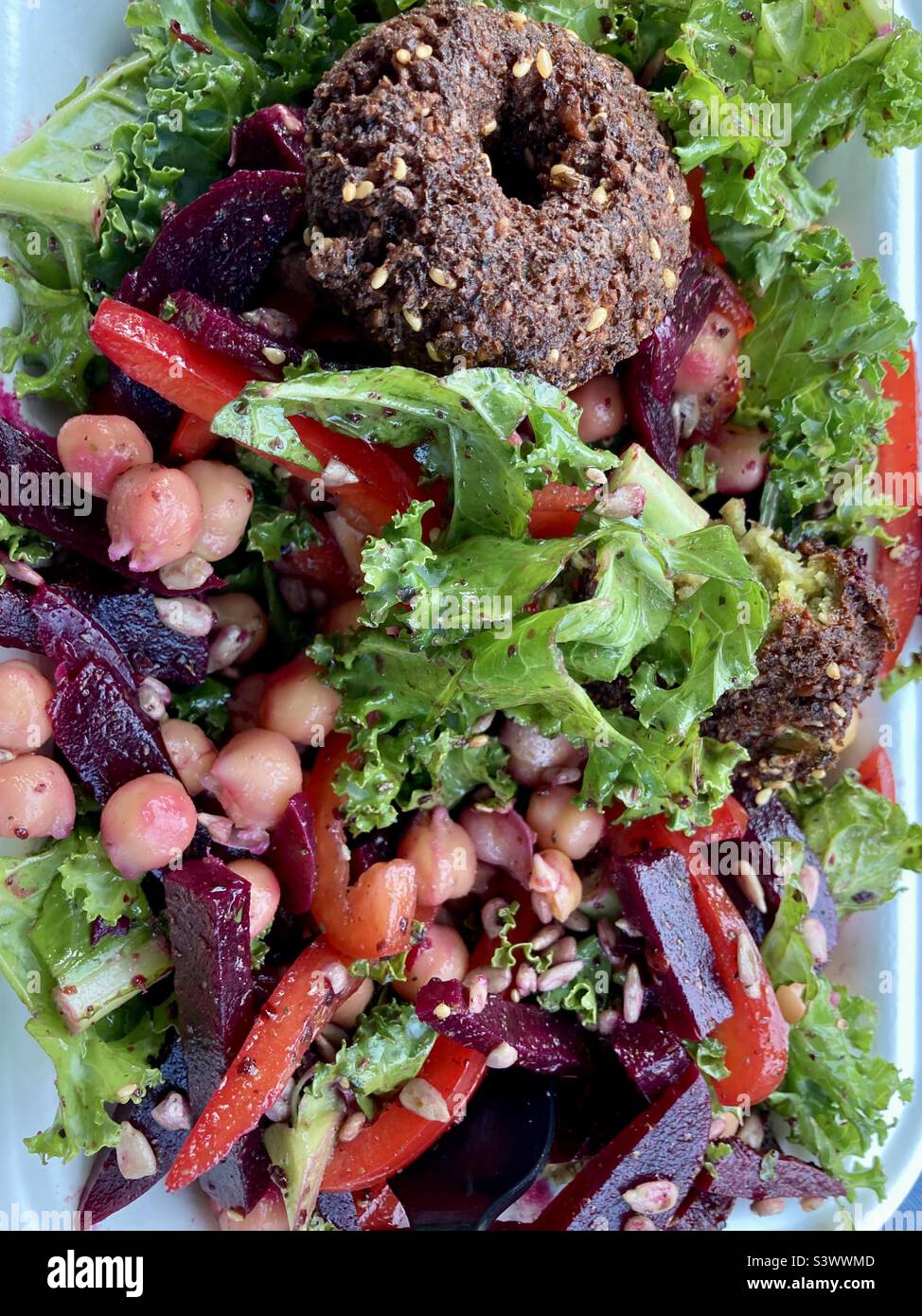 Healthy beet salad with chickpeas and falafel. - Smartphone Captured Stock Image