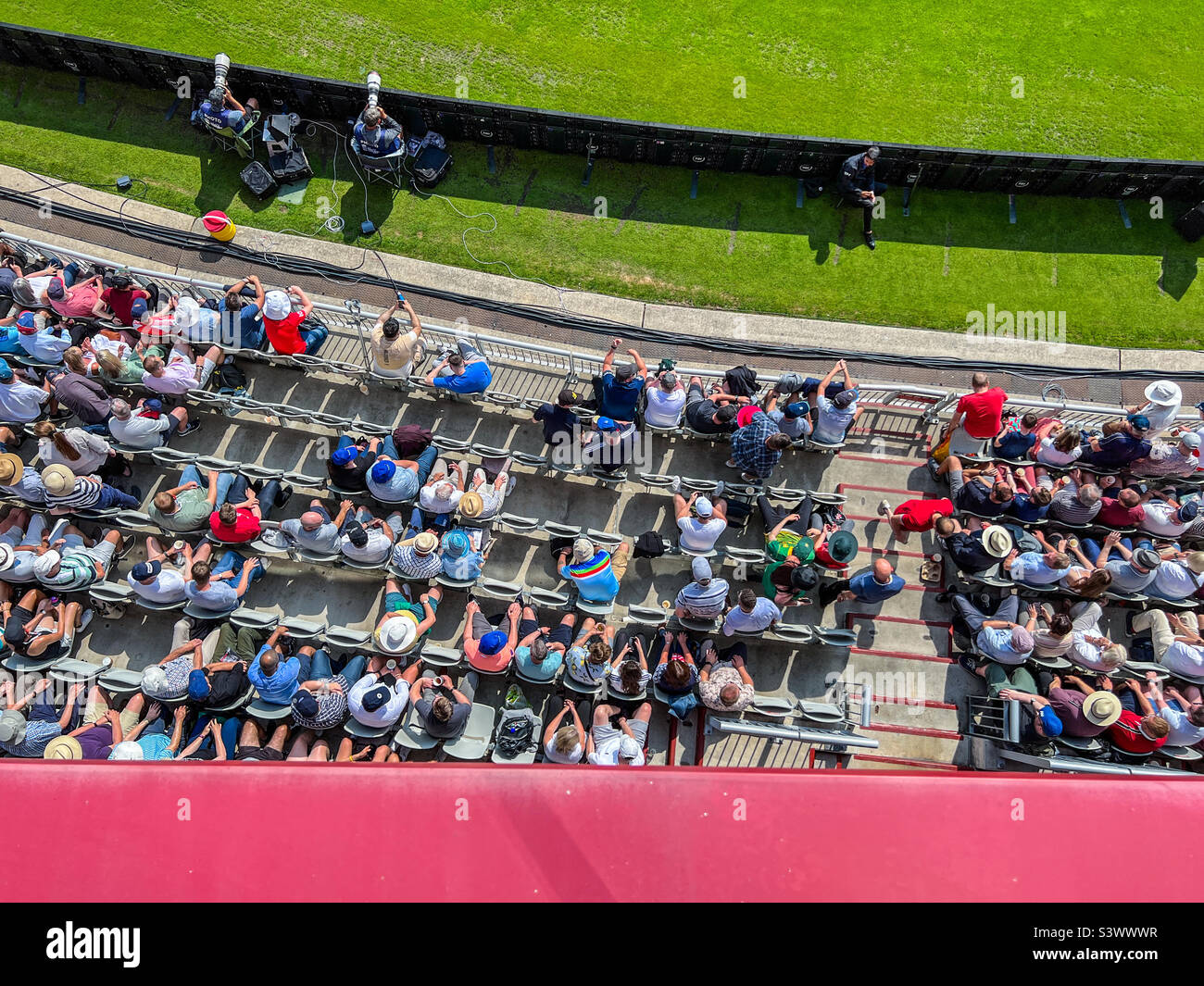 Crowd of spectators seated at Lancashire cricket club watching cricket Stock Photo