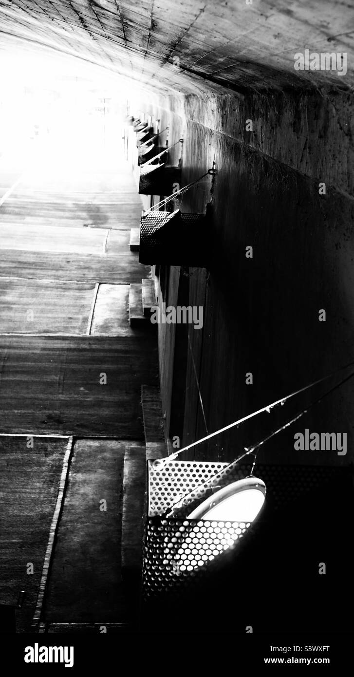 A row of lights in a downtown tunnel. - Smartphone Captured Stock Image A row of lights in a downtown tunnel. - Smartphone Captured Stock Image
