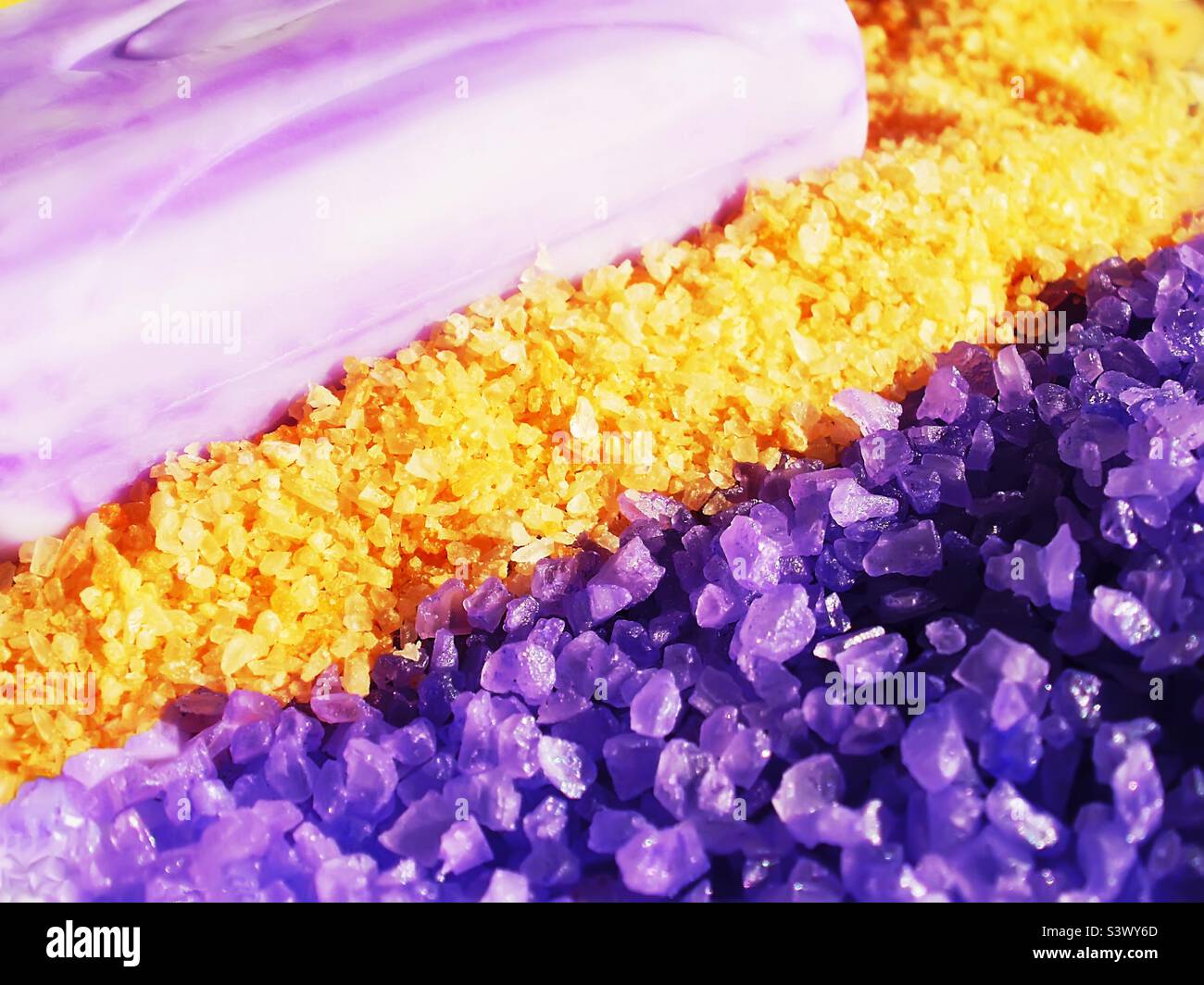 Purple soap bar and purple and yellow sea salt - Smartphone Captured Stock Image