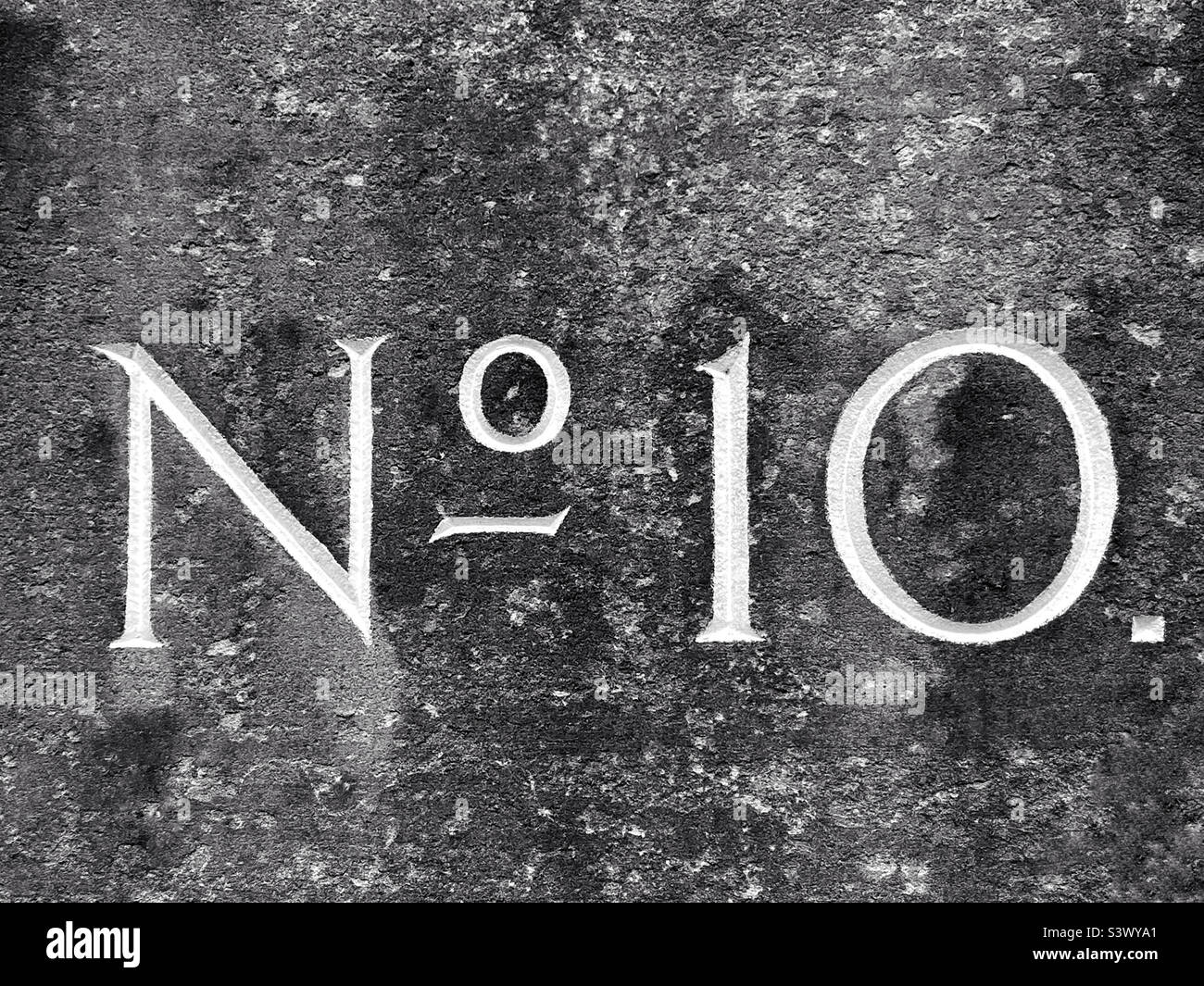 No. 10. Number 10. Number Ten. Identification engraved into a stone block indicating the number of a house or building. Photo ©️ COLIN HOSKINS. - Smartphone Captured Stock Image