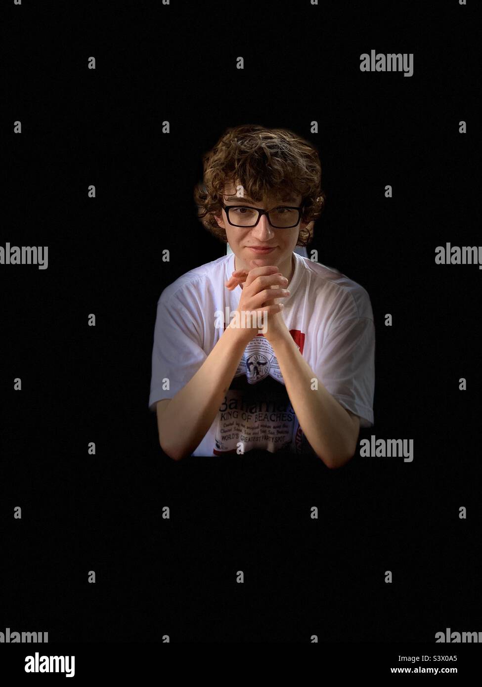 Portrait of a young man with curly hair. - Smartphone Captured Stock Image