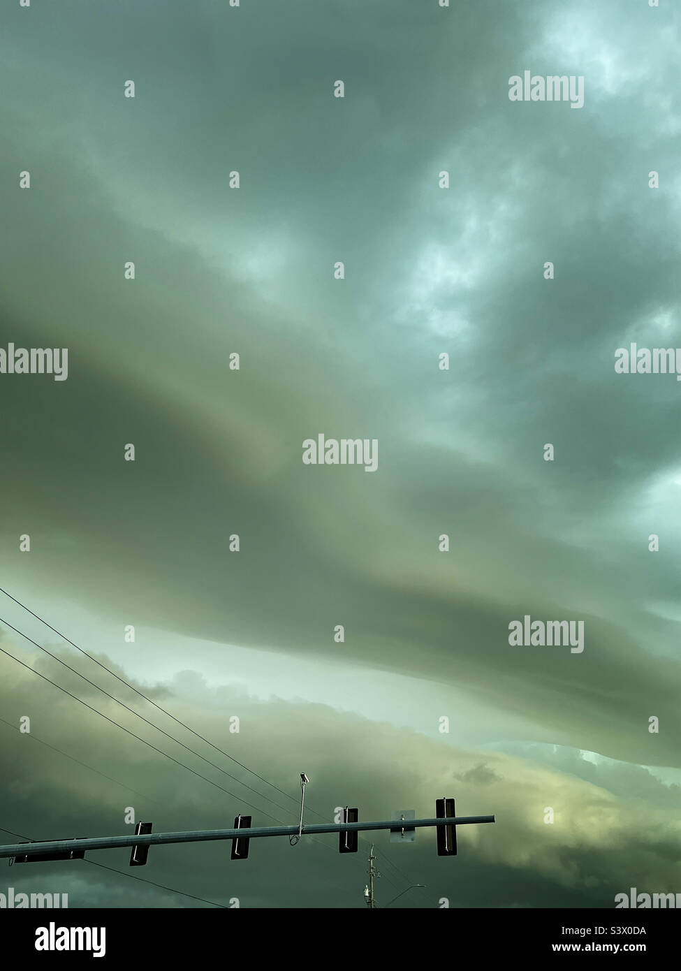 Storm clouds over traffic light - Smartphone Captured Stock Image
