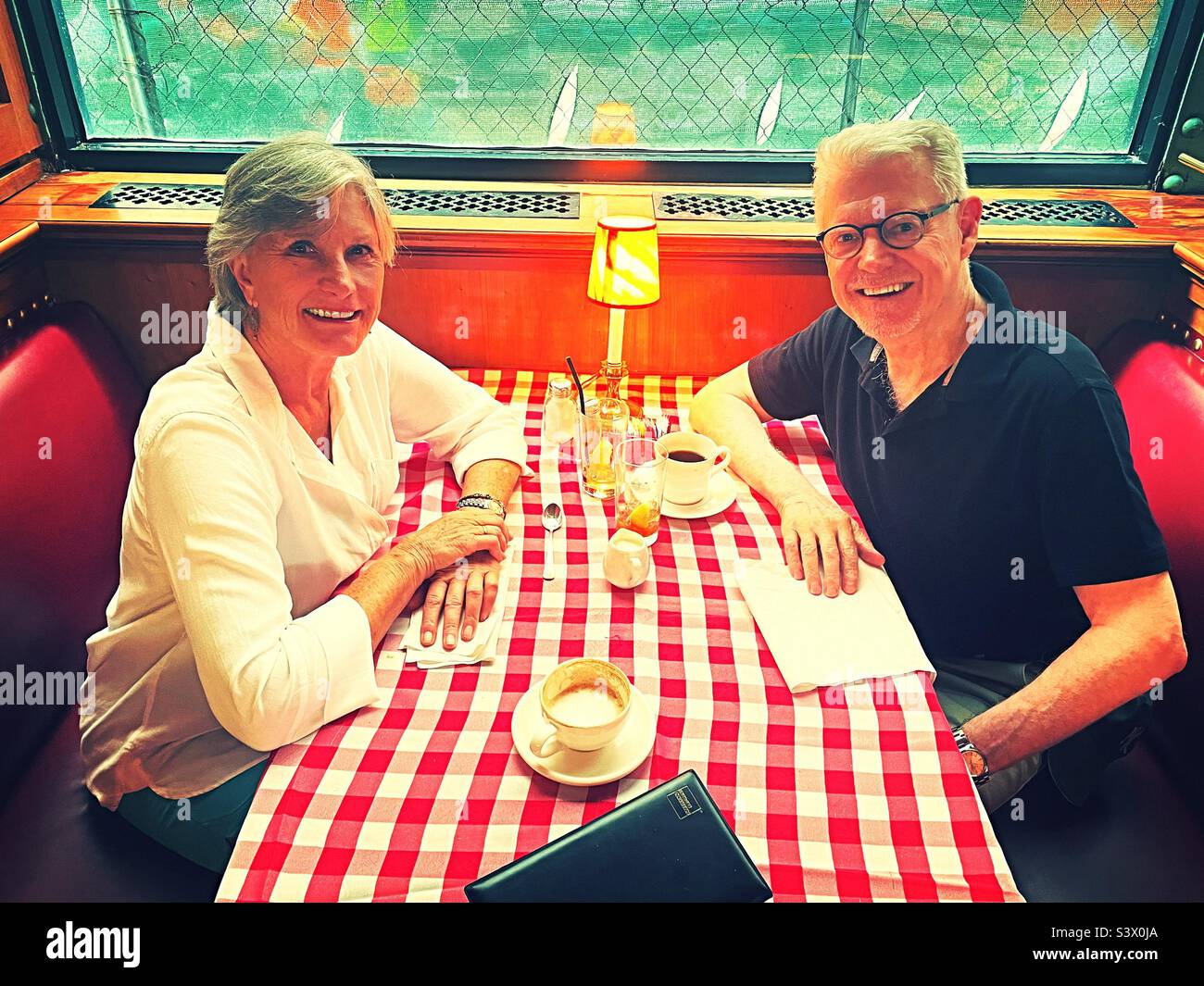 Senior couple enjoying a meal together at the Pershing Square restaurant near grand Central terminal, 2022, New York City, USA Stock Photo