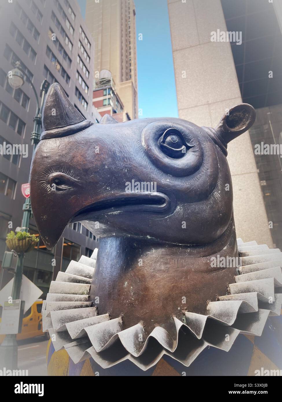 Whimsical harlequin rhino bronze statue in Pershing Square park in front of Grand Central terminal on 42nd St., 2022, New York City, USA Stock Photo