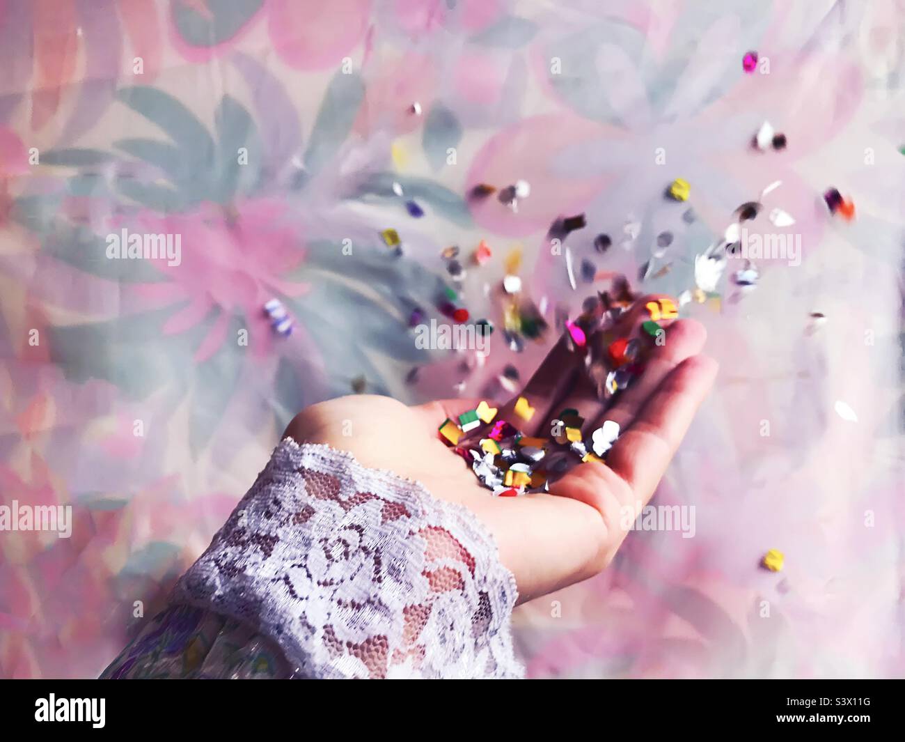 Throwing colorful confetti Stock Photo Alamy