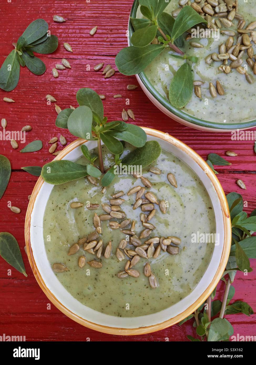 Purslane soup with sunflower seeds. Stock Photo