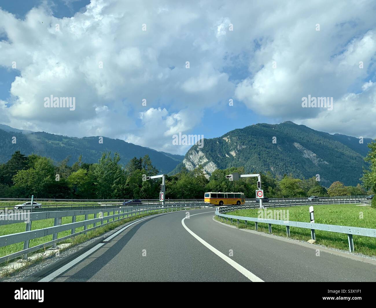 Yellow bus in Switzerland - Smartphone Captured Stock Image