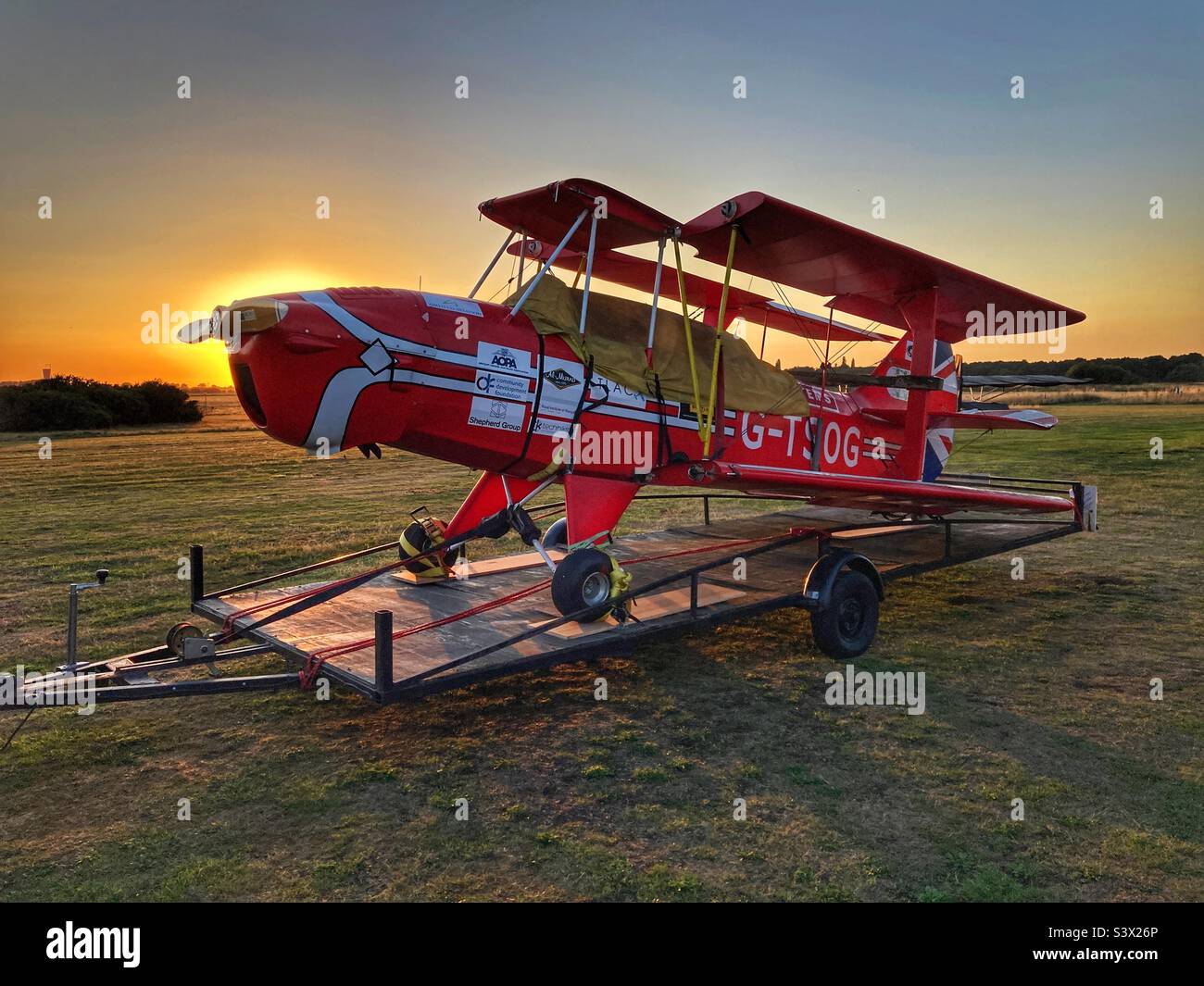 Sherwood Ranger biplane on trailer at sunset Stock Photo