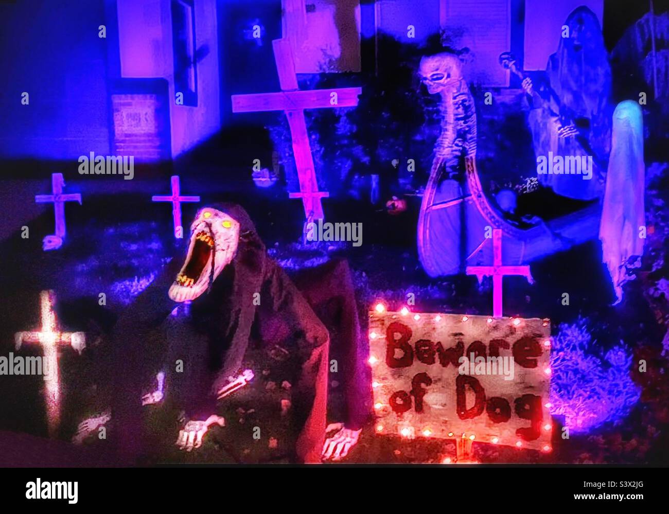 One neighborhood in Utah, USA really got into the Halloween season, decking out their homes and yards to maximize the creepiness factor. This “dog” was animated and made growls worthy of hell itself. - Smartphone Captured Stock Image