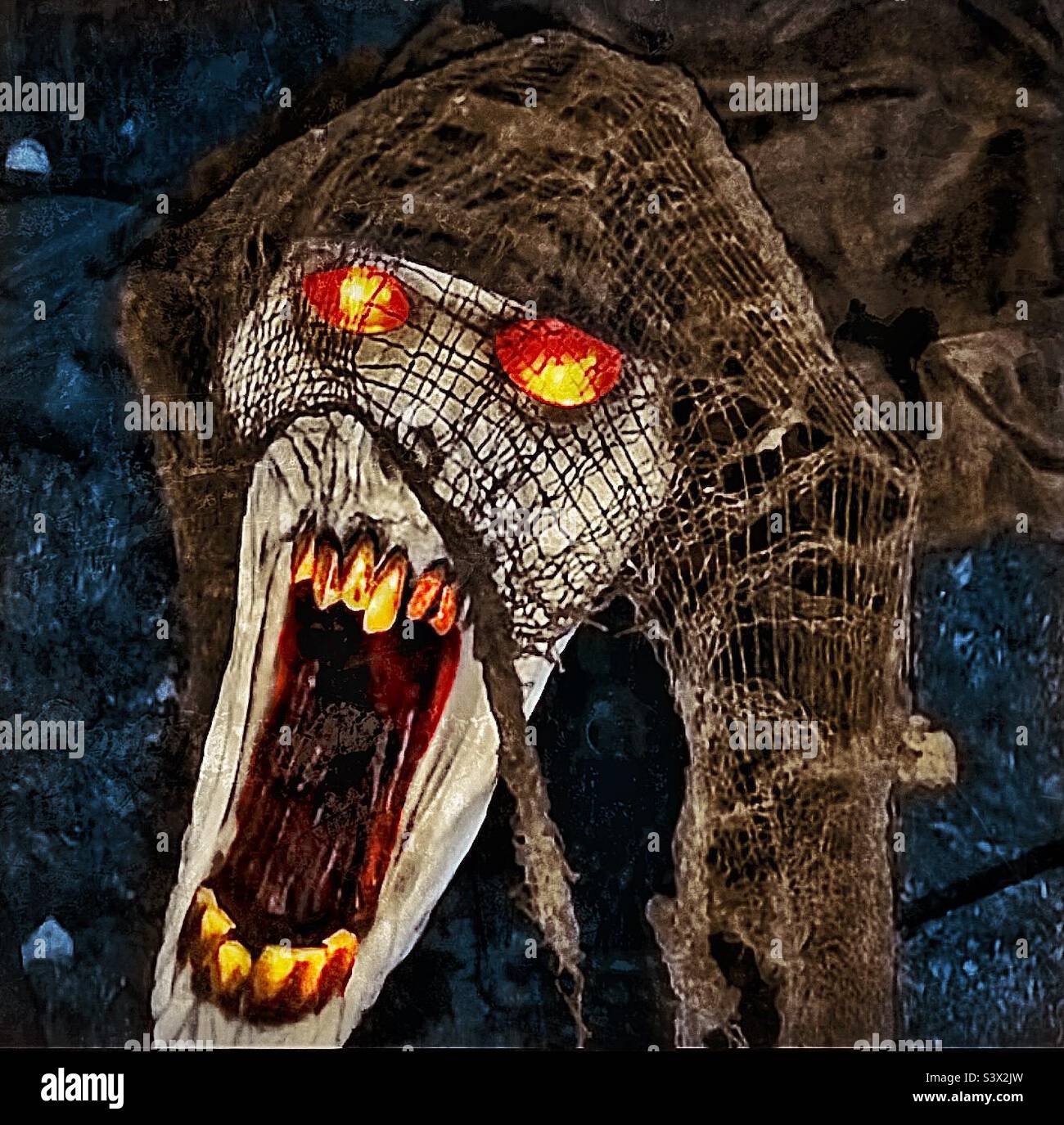 One neighborhood in Utah, USA really got into the Halloween season, decking out their homes and yards to maximize the creepiness factor. This “dog” was animated and made growls worthy of hell itself. - Smartphone Captured Stock Image