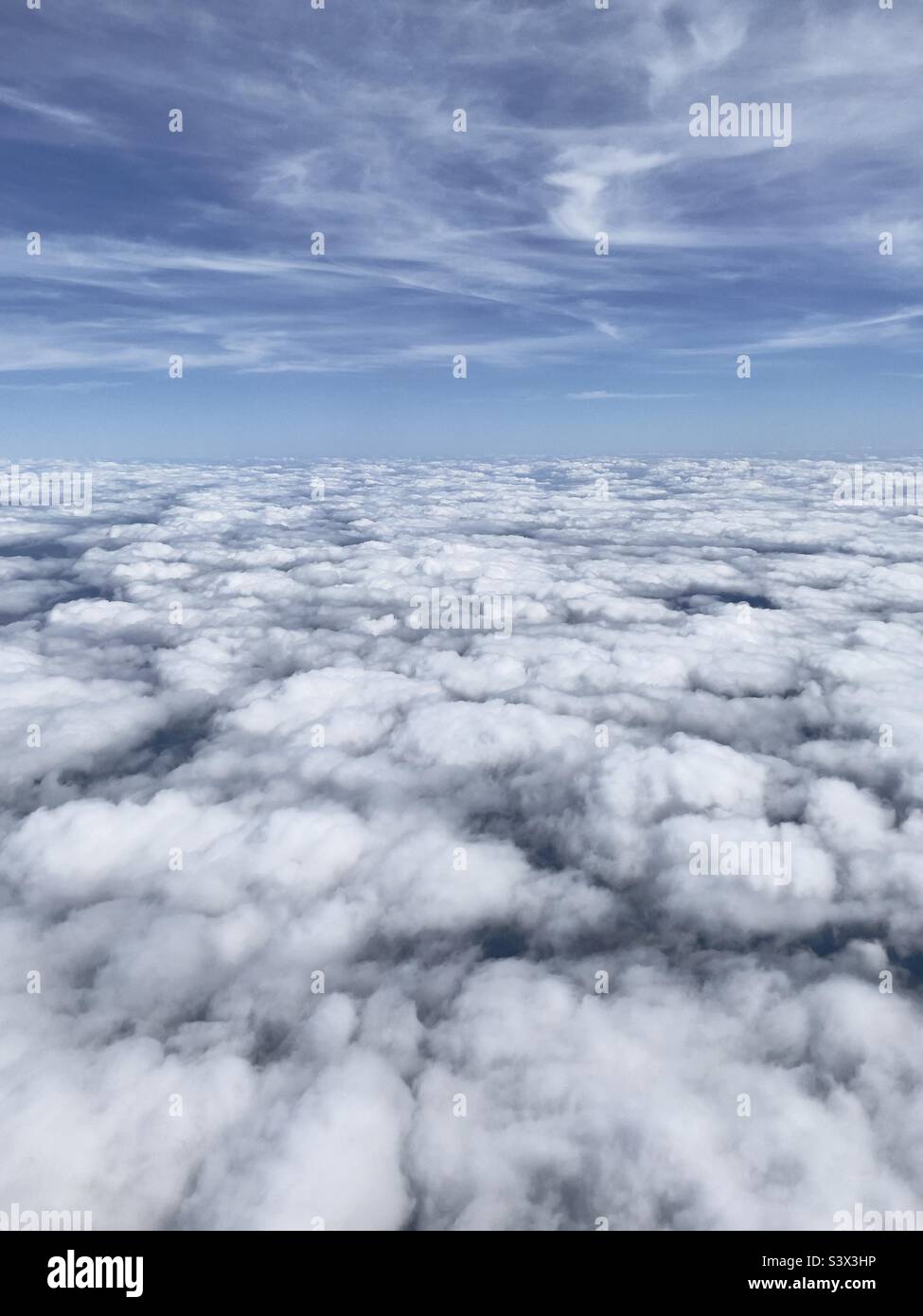 Flying over cloud base Stock Photo