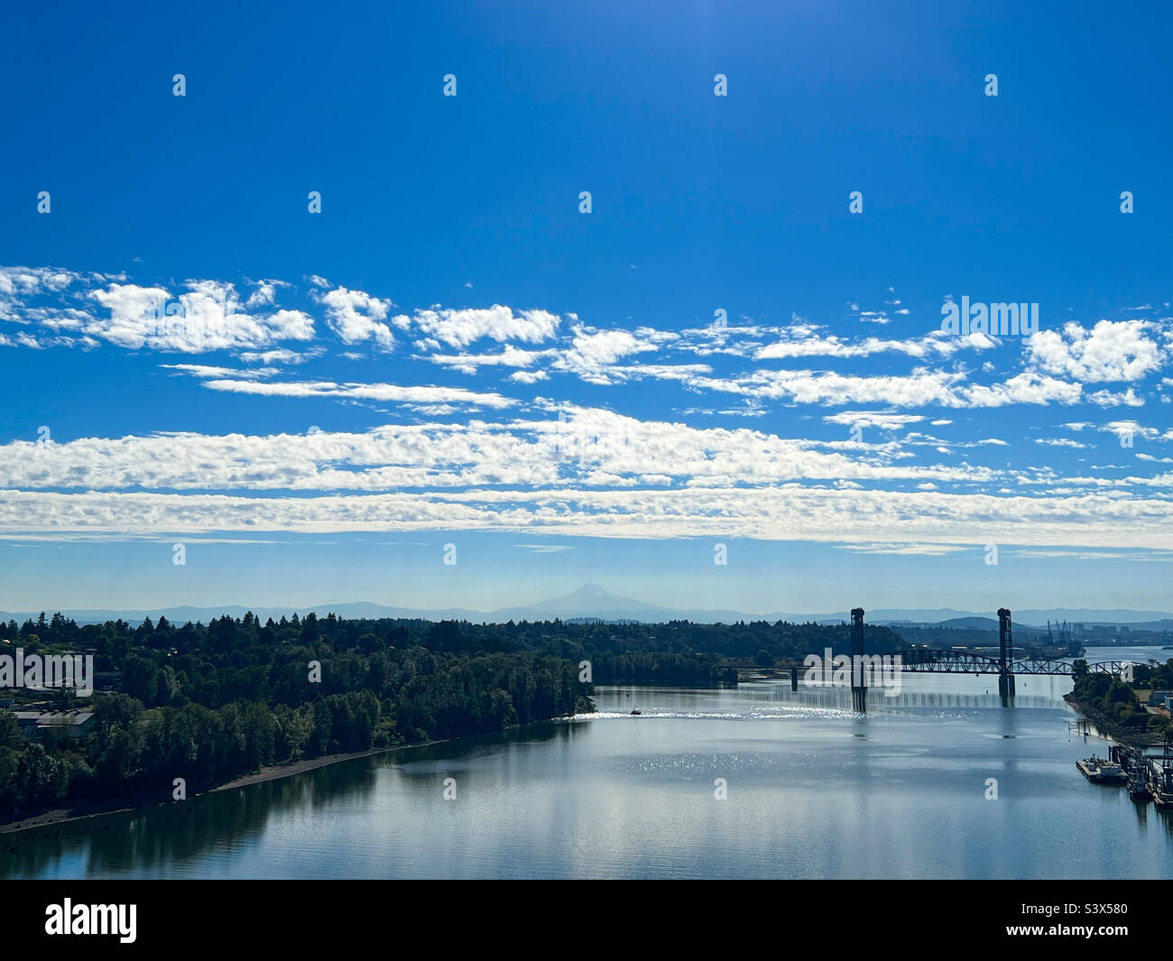 The Willamette River and Mt. Hood as seen from The St. John’s Bridge in Portland, Oregon on August 22, 2022. - Smartphone Captured Stock Image