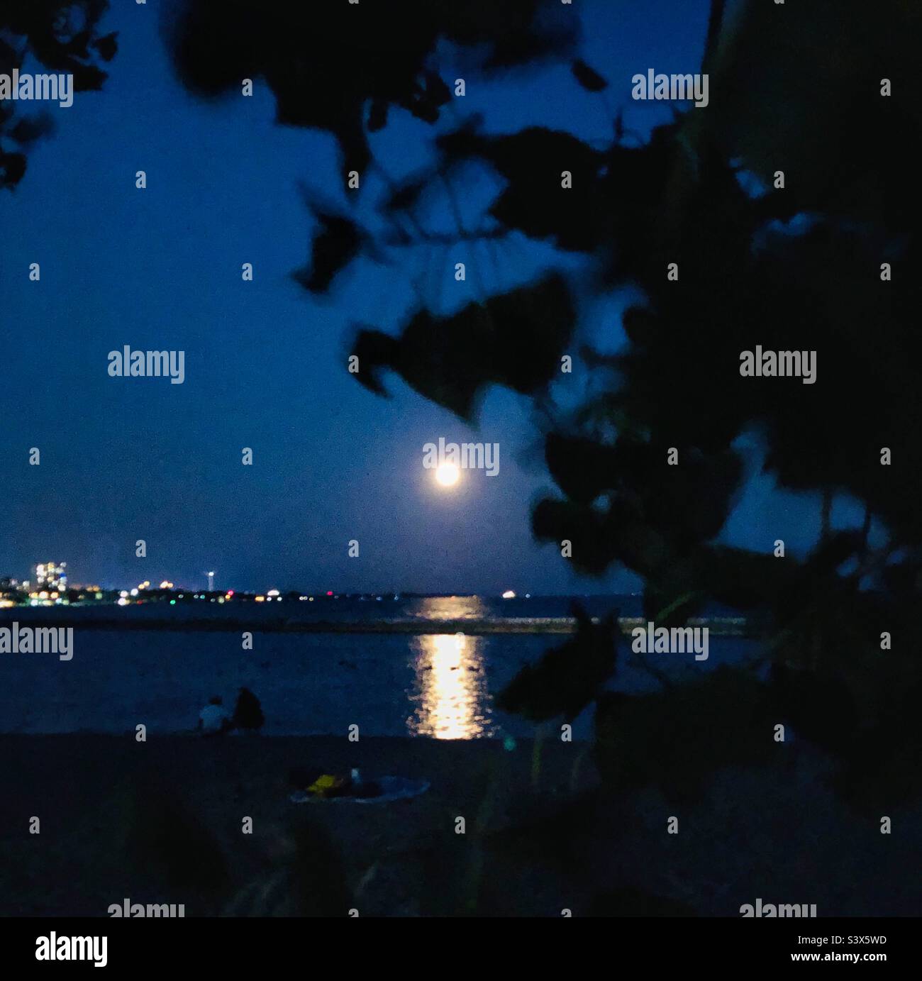 Full moon over Lake Ontario, Toronto. Stock Photo