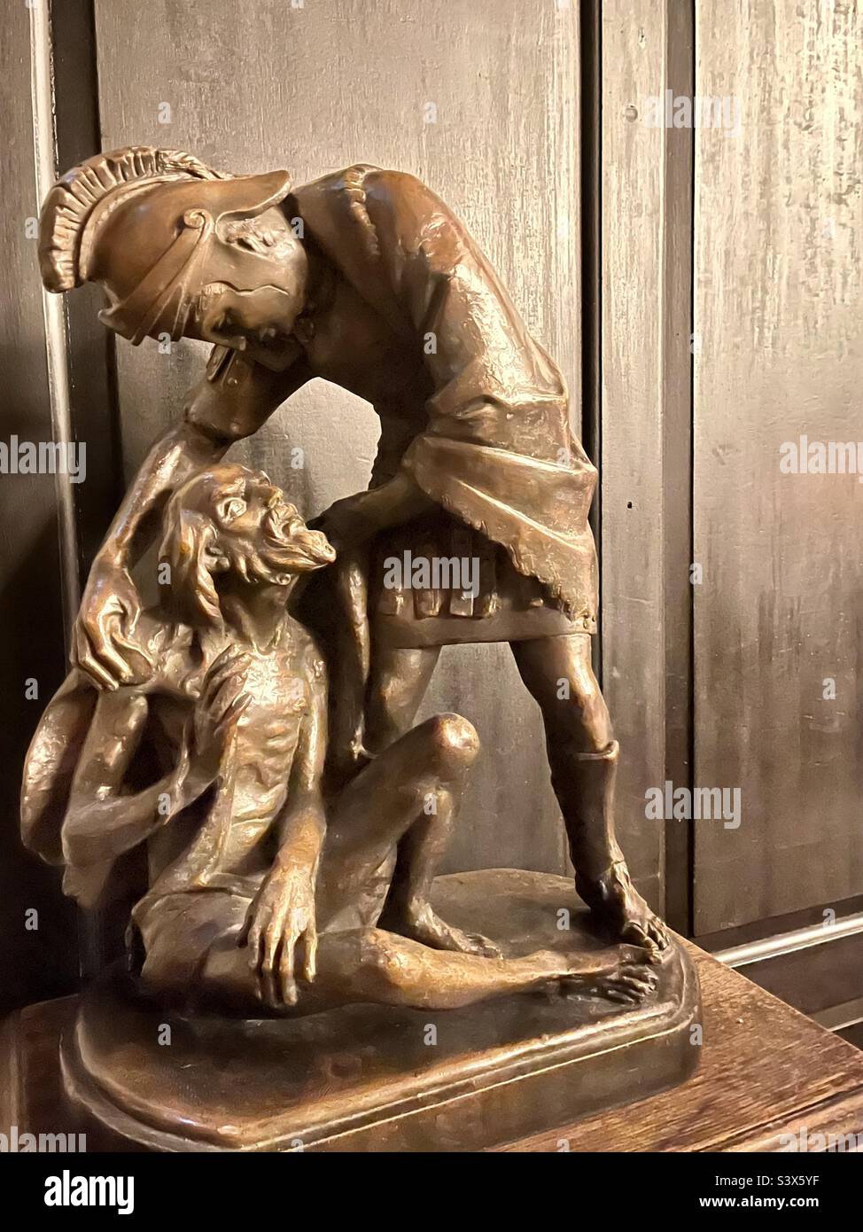 Sculpture by James Butler called ‘St Martin and the beggar’ and can be found at St Martin-in-the-Fields Church,Trafalgar Square, London. St Martin is patron saint of beggars, soldiers and France. - Smartphone Captured Stock Image